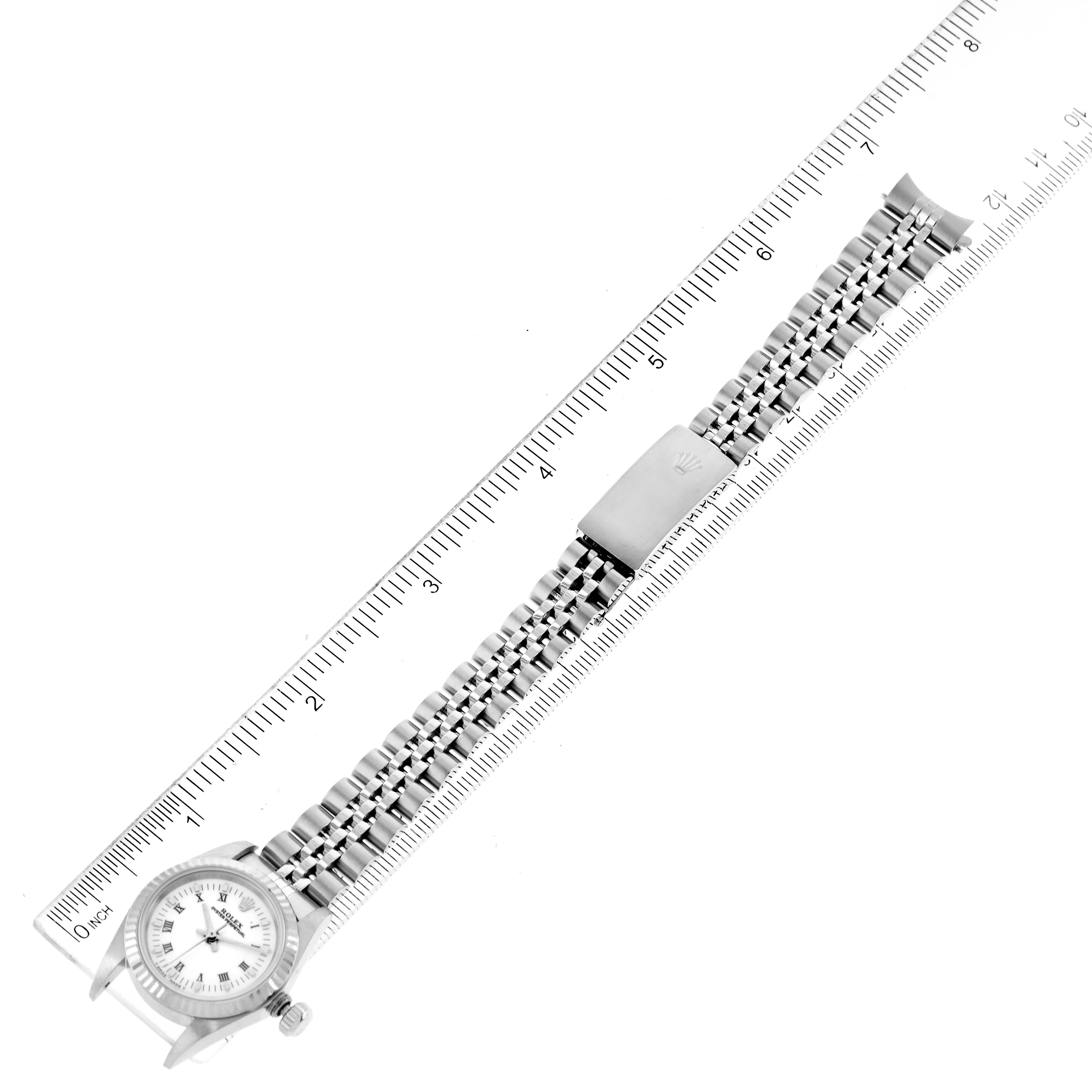 The image shows a top view of the Rolex Oyster Perpetual 67194 Women's Stainless Steel White Dial 67194 Women's Stainless Steel White Dial watch, including the face, bezel, bracelet, and clasp.