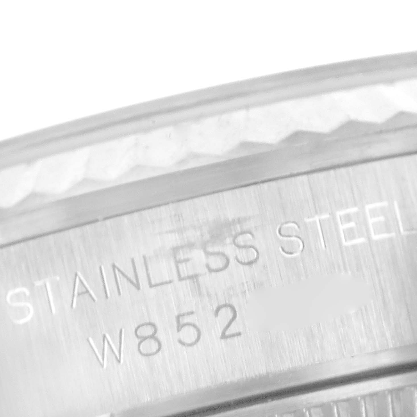 This image shows a close-up of the engraved stainless steel casing of the Rolex Oyster Perpetual 67194 Women's Stainless Steel White Dial 67194 Women's Stainless Steel White Dial watch.