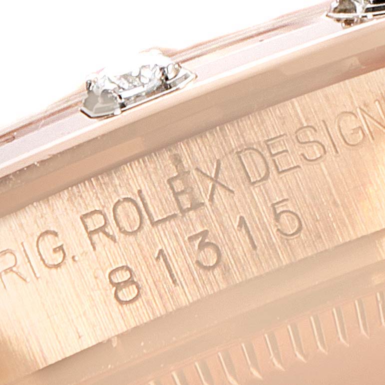 This image shows a close-up of the serial number and part of the bezel with diamonds on the Rolex Pearlmaster 81315 Women
s Rose Gold Pink Dial 81315 Women
s Rose Gold Pink Dial watch.