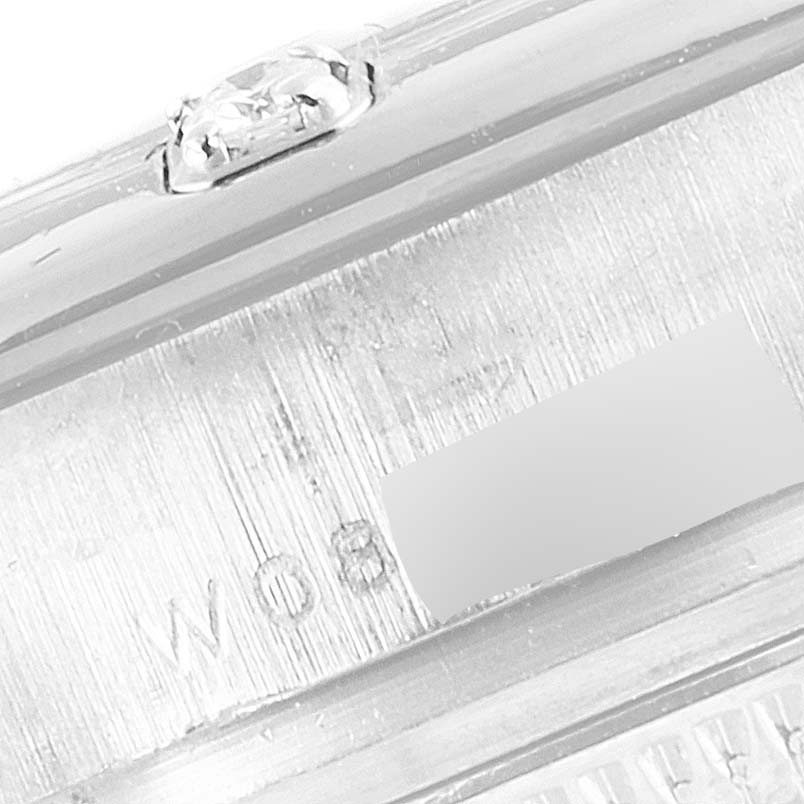 This close-up image shows the engraved details and diamond bezel setting of a Rolex Pearlmaster 69319 Women's White Gold Silver Dial 69319 Women's White Gold Silver Dial watch.
