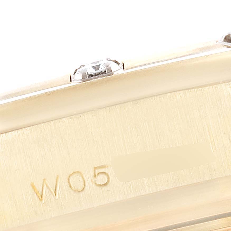 This is a close-up angle showing part of the case and markings on the Rolex Pearlmaster 69318 Women's Yellow Gold White Dial 69318 Women's Yellow Gold White Dial watch.