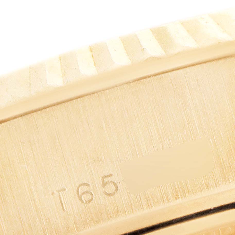 This image shows a close-up of the side of the Rolex President 69178 Women's Yellow Gold Champagne Dial 69178 Women's Yellow Gold Champagne Dial watch, highlighting its bezel and engraved model number.