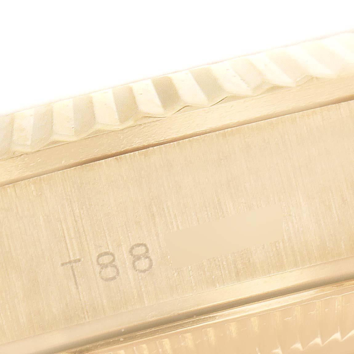 This close-up image shows the side engraving and fluted bezel of a Rolex President 67198 Women
s Yellow Gold Champagne Dial 67198 Women
s Yellow Gold Champagne Dial model watch.