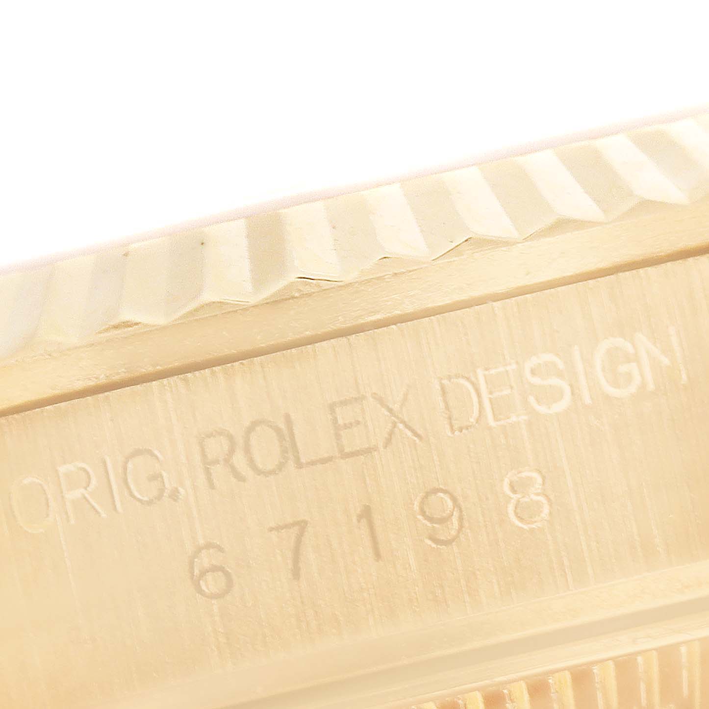 This close-up shot shows the model number and part of the bezel of the Rolex President 67198 Women
s Yellow Gold Champagne Dial 67198 Women
s Yellow Gold Champagne Dial watch.