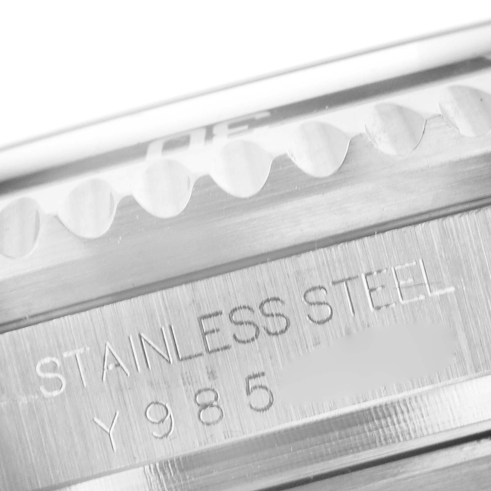 The image shows a close-up of the Rolex Sea-Dweller 16600 Men
s Stainless Steel Black Dial 16600 Men
s Stainless Steel Black Dial
s stainless steel case back engraving and part of the ridged bezel.