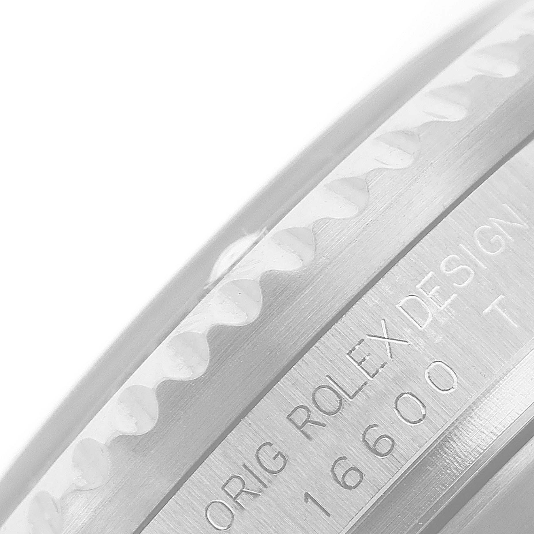 The image shows a close-up side view of the bezel and the engraved case side of a Rolex Sea-Dweller 16600 Men
s Stainless Steel Black Dial 16600 Men
s Stainless Steel Black Dial model.