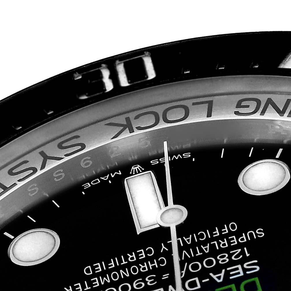 This close-up image of the Rolex Sea-Dweller 126660 Men's Stainless Steel Blue Dial 126660 Men's Stainless Steel Blue Dial watch shows the dial, hands, and part of the bezel with the "RING LOCK SYSTEM" text.