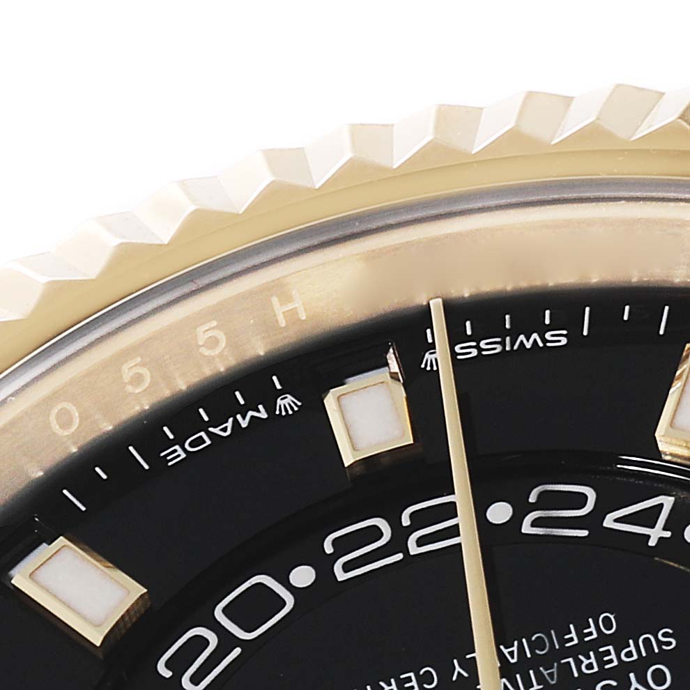 This image shows a close-up of the bezel, dial, and hour markers of the Rolex Sky-Dweller 336238 Men's Yellow Gold Black Dial 336238 Men's Yellow Gold Black Dial watch, featuring the Swiss Made text.