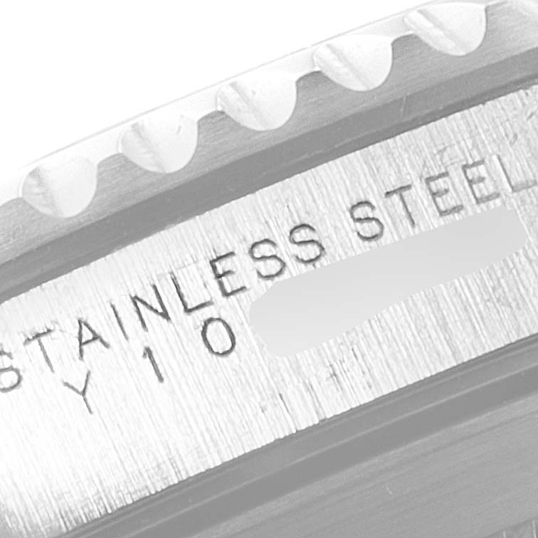 The image shows a close-up angle of the bezel and engraving on the side of the case back of a Rolex Submariner 14060 Men
s Stainless Steel Black Dial 14060 Men
s Stainless Steel Black Dial watch.