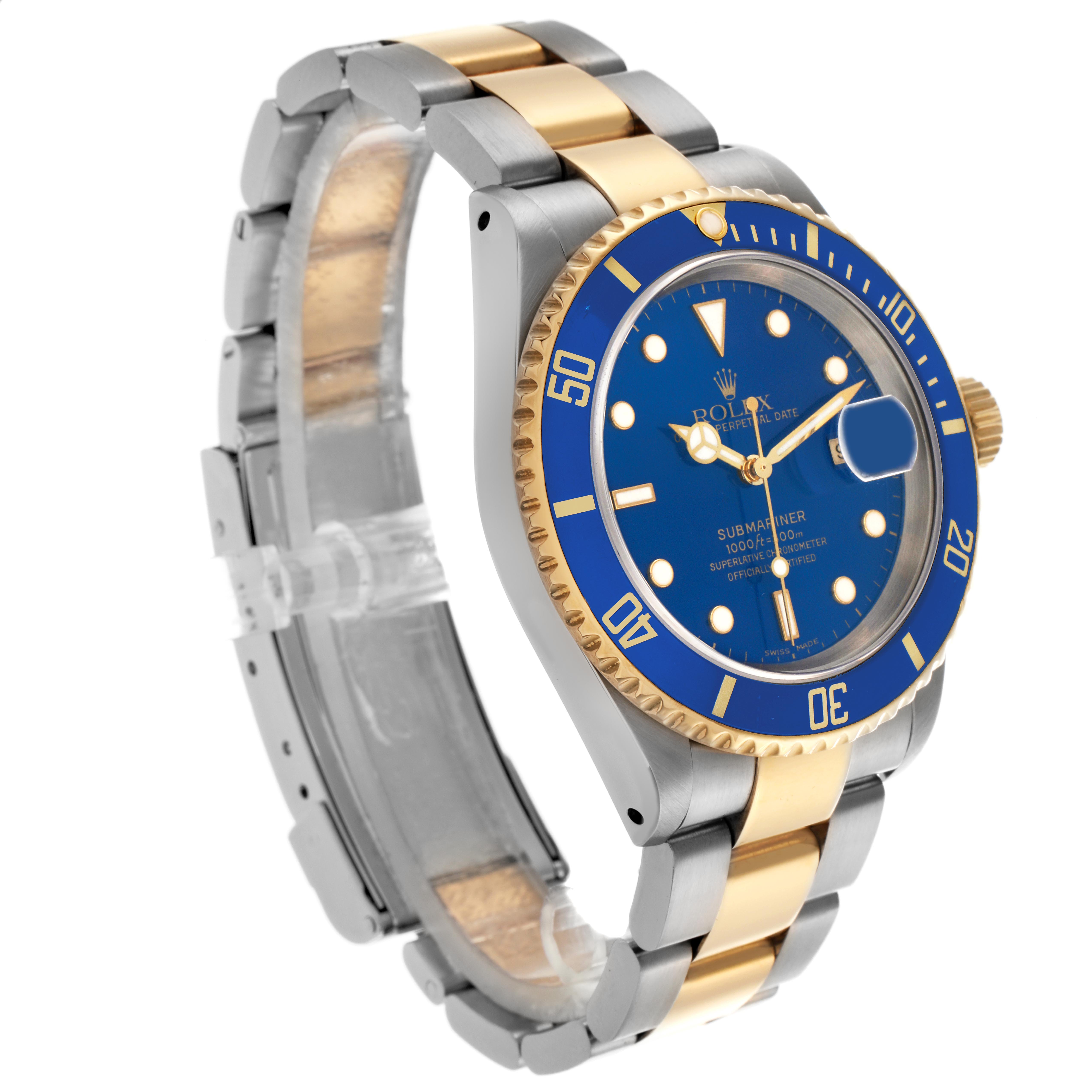 The Rolex Submariner 16613 Men's Steel and Gold (two tone) Blue Dial 16613 Men's Steel and Gold (two tone) Blue Dial watch is shown at an angle displaying the blue dial, gold bezel, and two-tone bracelet.
