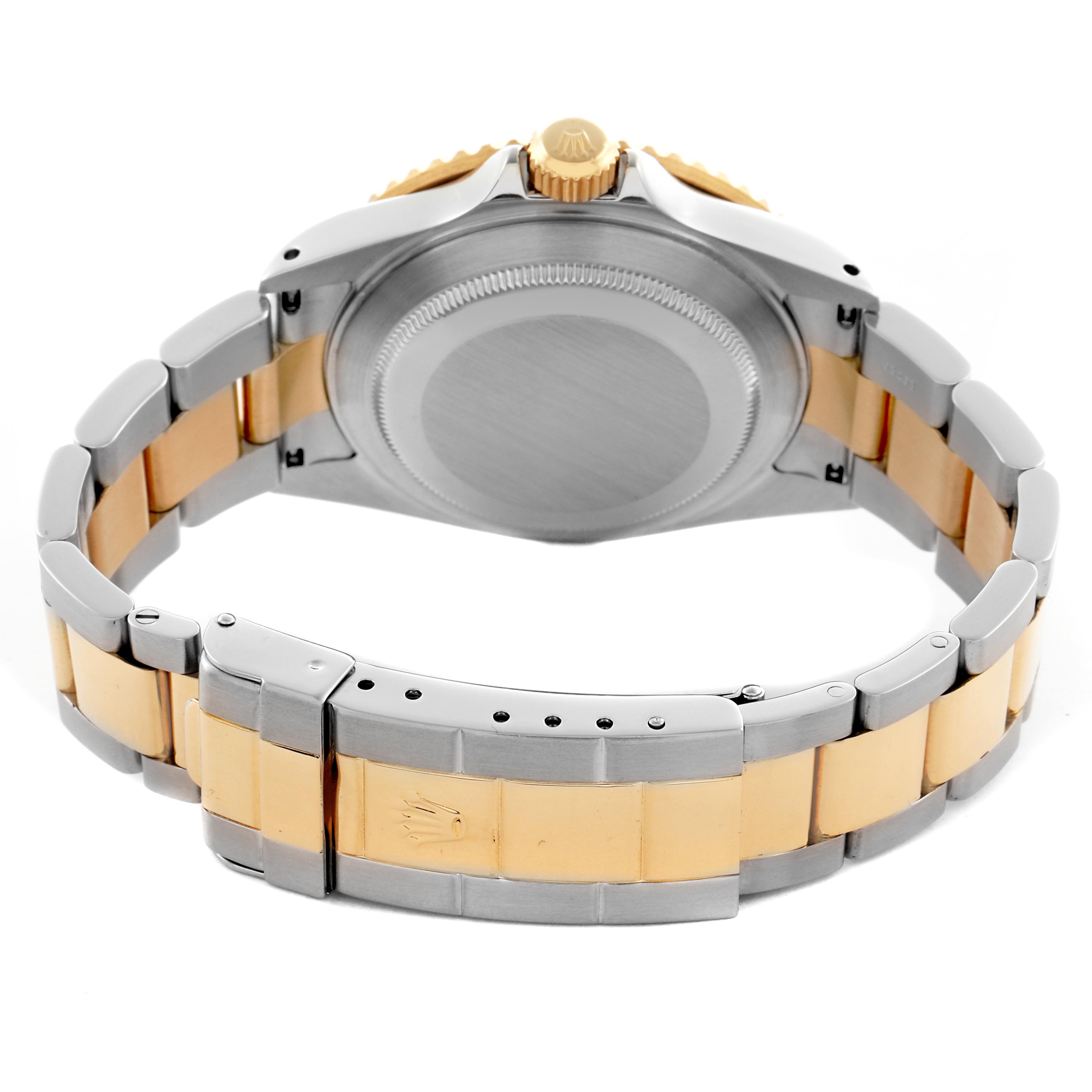 The image shows the back view of a Rolex Submariner 16613 Men's Steel and Gold (two tone) Blue Dial 16613 Men's Steel and Gold (two tone) Blue Dial, highlighting the case back, bracelet, and clasp.