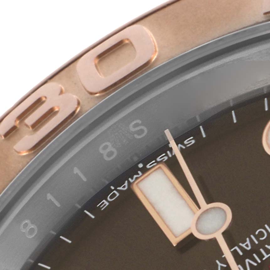 The image shows a close-up top view of the Rolex Turn-o-Graph watch, highlighting the bezel and part of the dial.