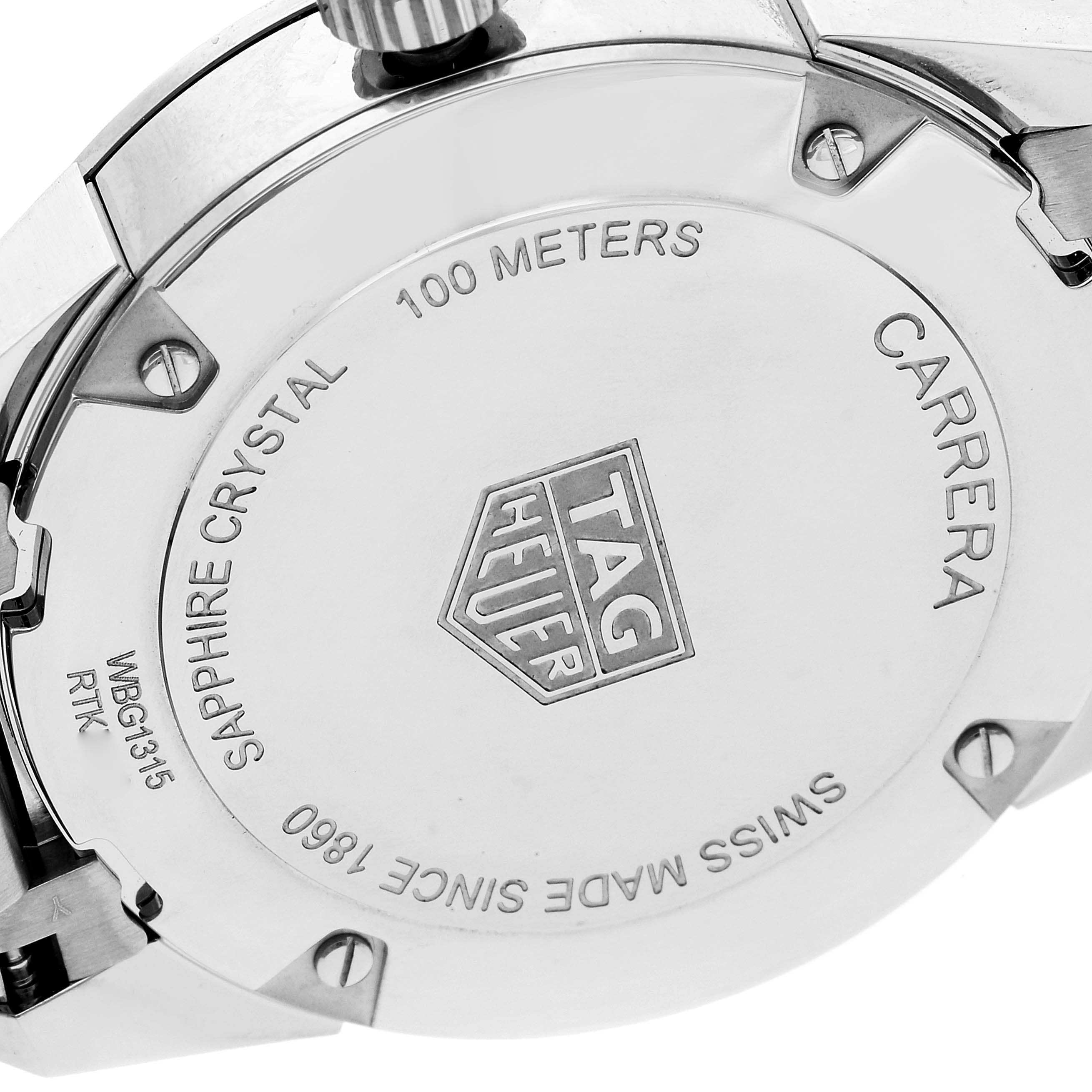 The image shows the back case of a Tag Heuer Carrera WBG1315 Women's Stainless Steel Mother of Pearl Dial WBG1315 Women's Stainless Steel Mother of Pearl Dial watch, detailing its water resistance and sapphire crystal.
