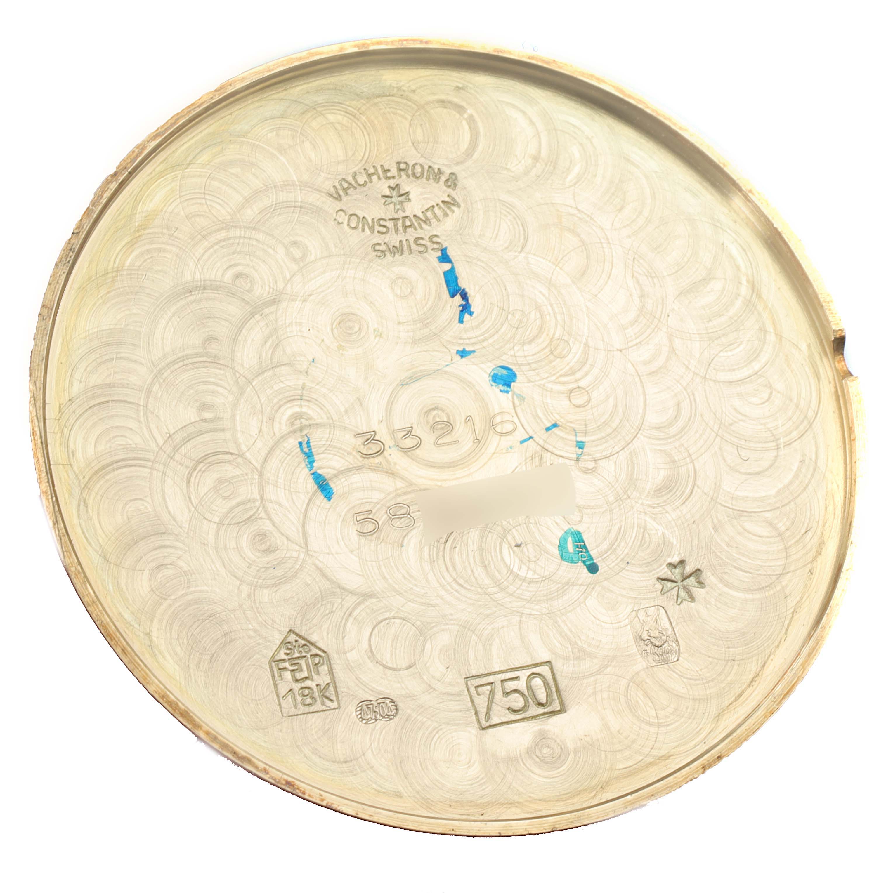 This image shows the interior case back of a Vintage Vacheron Constantin watch, displaying various engravings and hallmarks.
