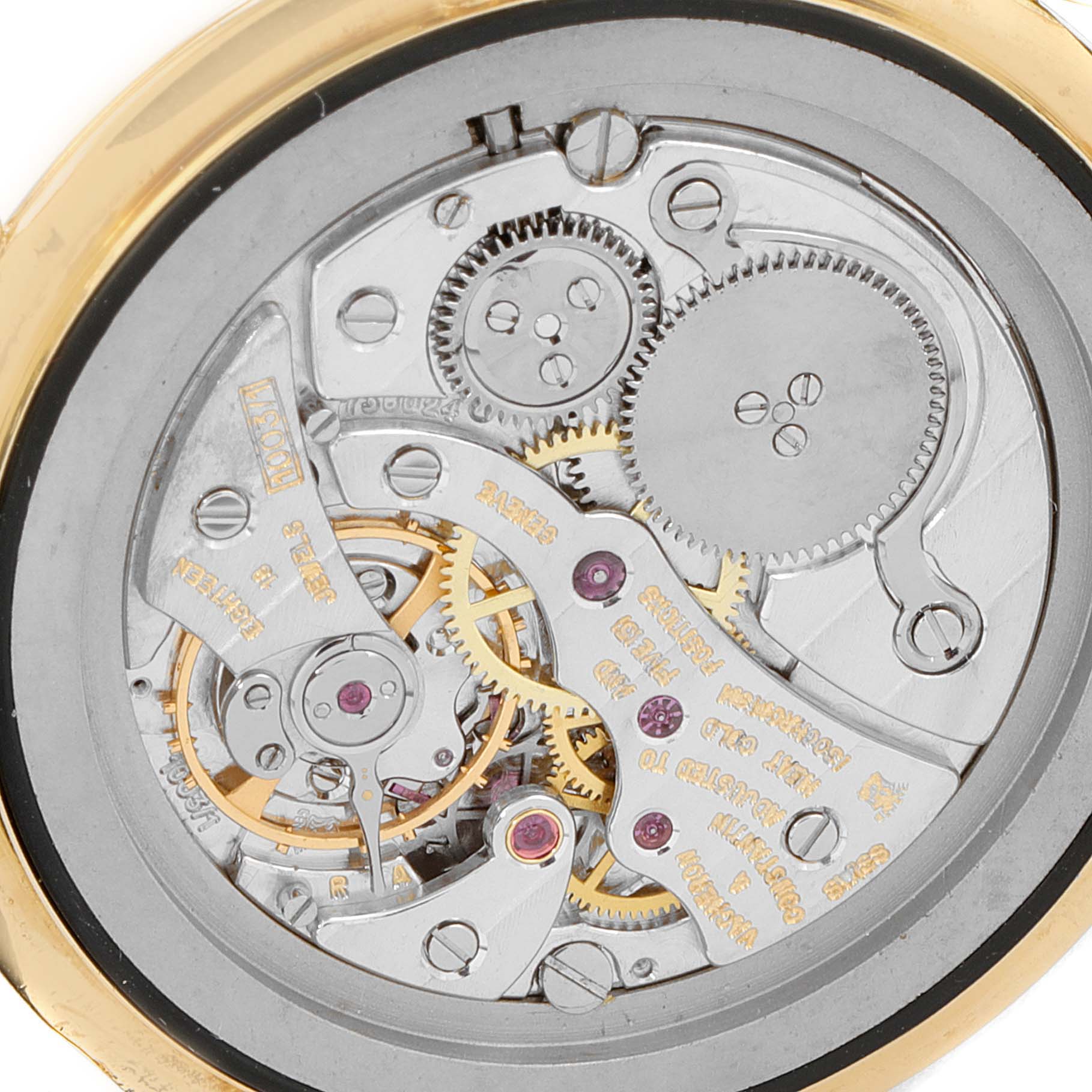 This image shows the intricate inner workings of a Vintage Vacheron Constantin watch from a close-up, back case view.