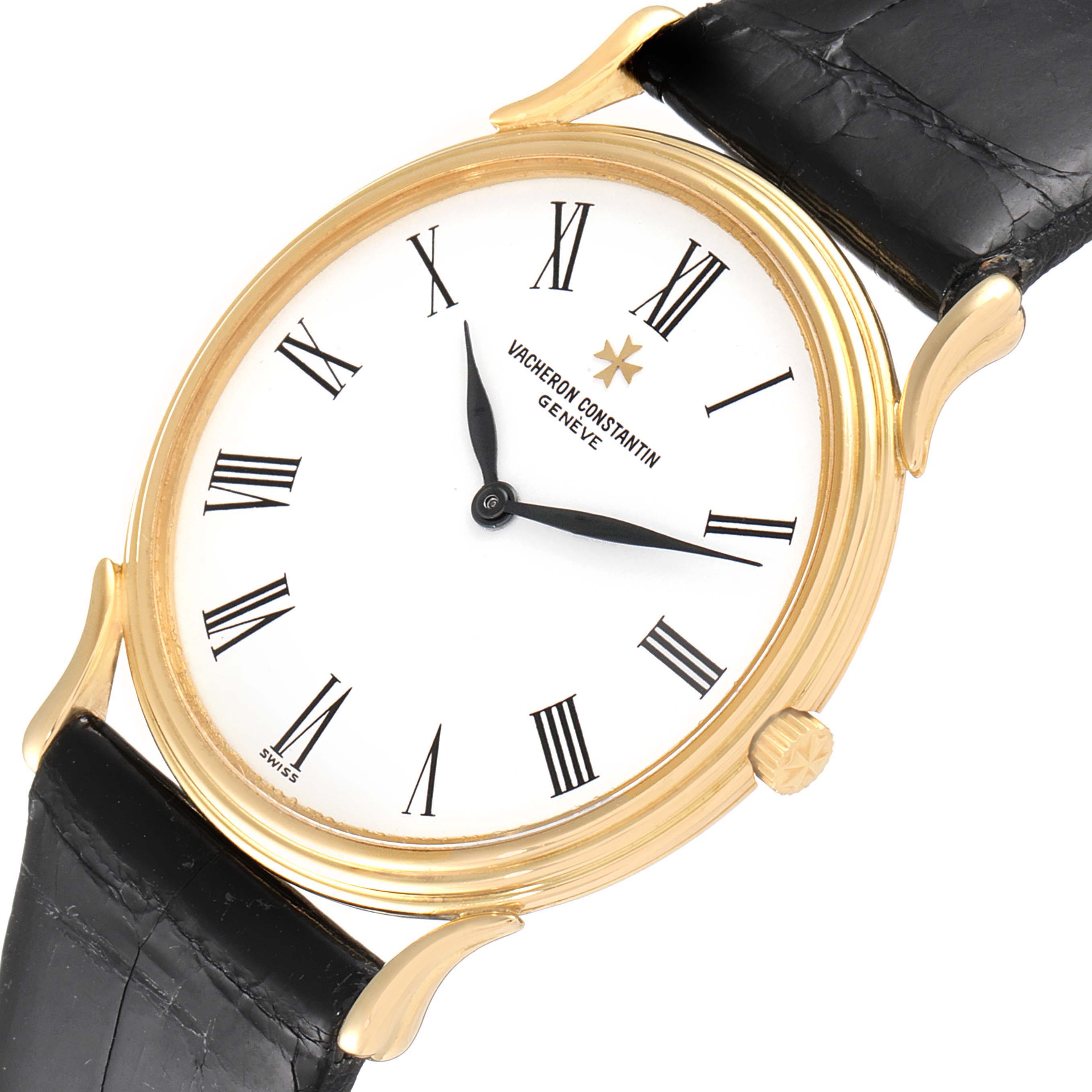 The Vacheron Constantin Vintage 33216 Men's Yellow Gold White Dial 33216 Men's Yellow Gold White Dial model watch is shown from a front angle, highlighting its gold case, Roman numeral dial, and black leather strap.