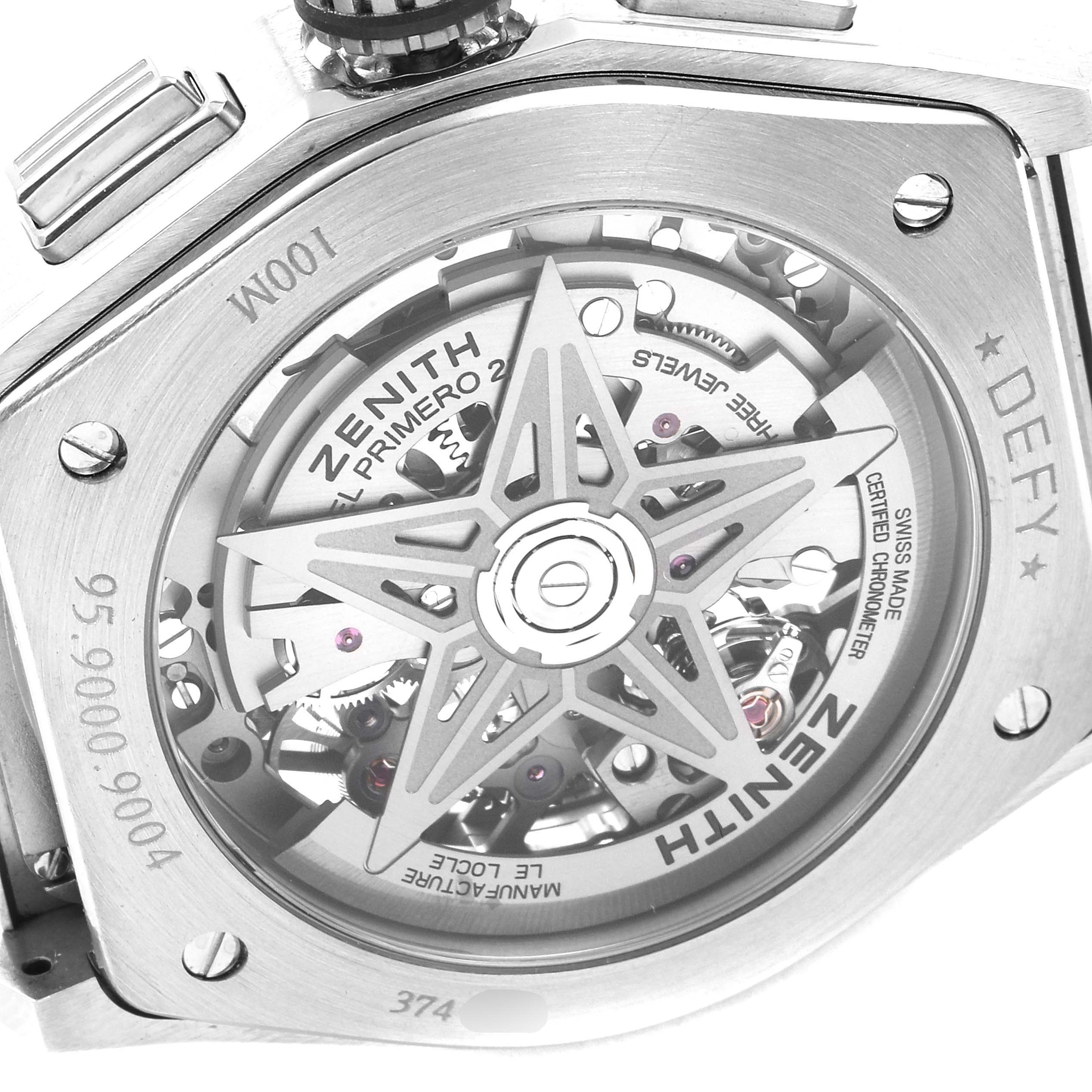The image shows the back of a Zenith Defy 95.9000.9004/78.M9000 Men's Titanium Grey Dial 95.9000.9004/78.M9000 Men's Titanium Grey Dial watch, highlighting the intricate movement and mechanism through a transparent case back.