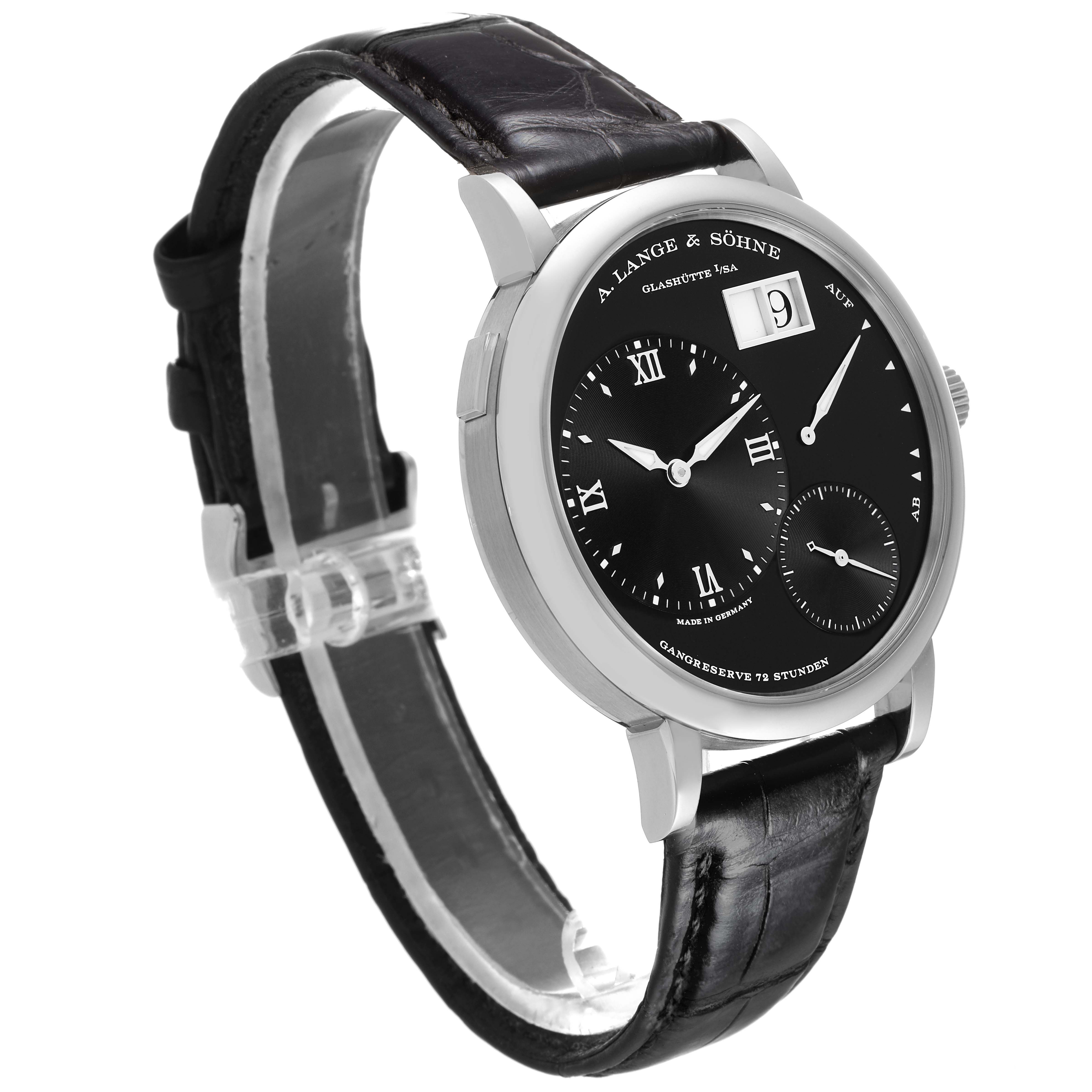 The A. Lange & Sohne Lange 1 117.028 Men's White Gold Black Dial watch is shown at a slight angle, highlighting the dial, leather strap, and buckle.