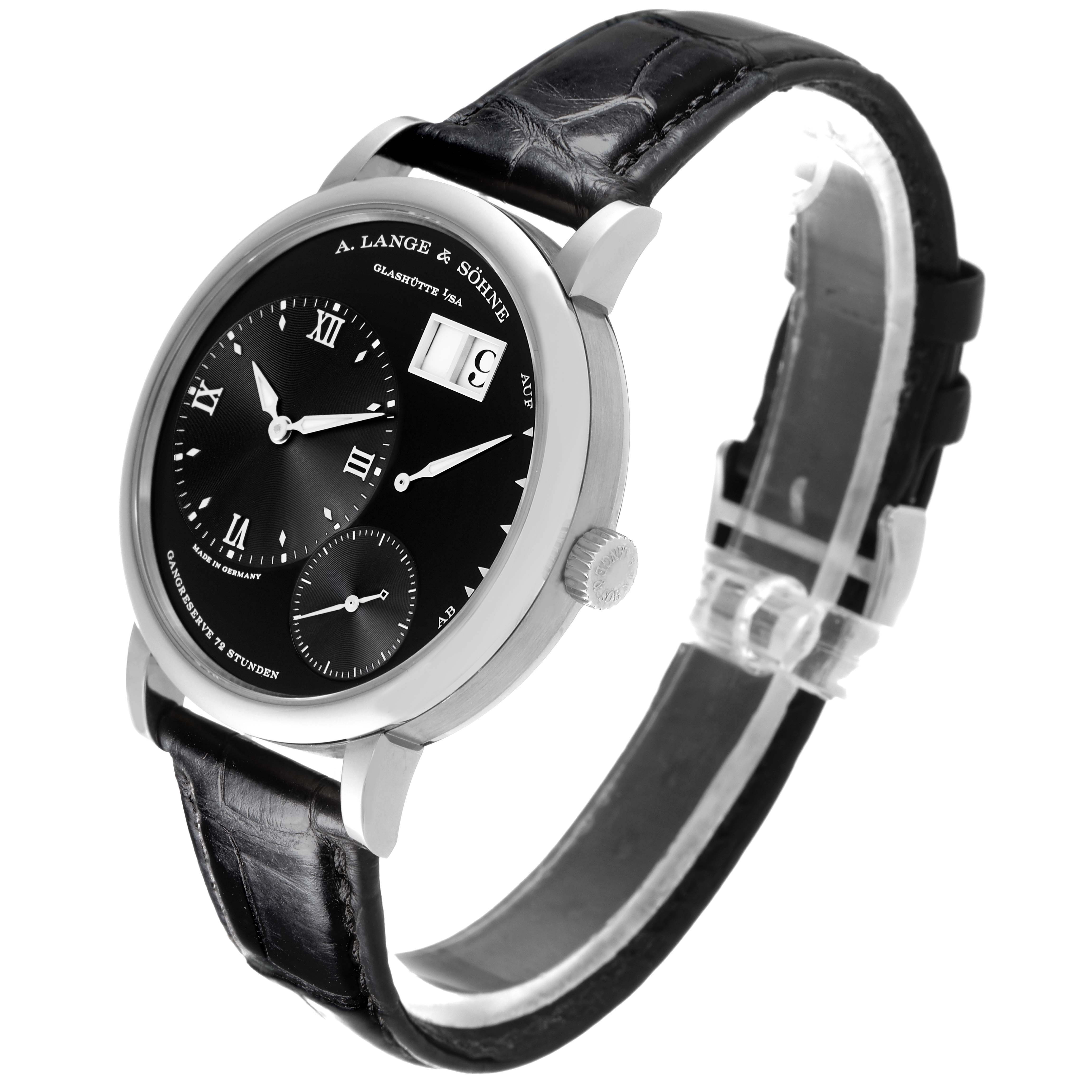 The A. Lange & Sohne Lange 1 117.028 Men's White Gold Black Dial watch is shown at an angled side view, highlighting the face, case, crown, and leather strap.