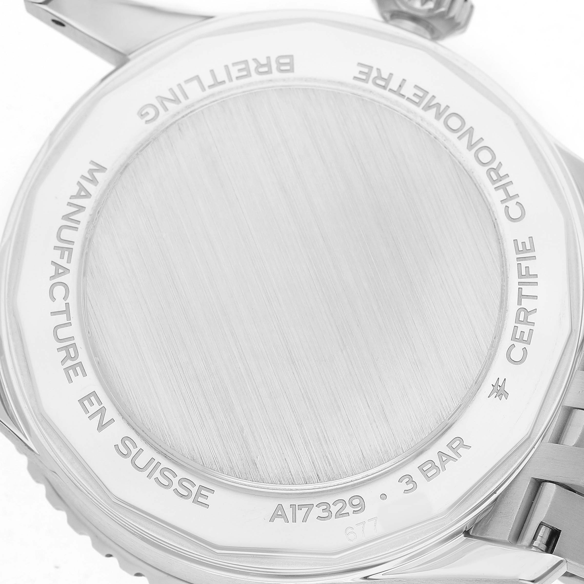 The image shows the back casing of a Breitling Navitimer A17329 Men's Stainless Steel Blue Dial watch, displaying engraved details and water resistance rating.