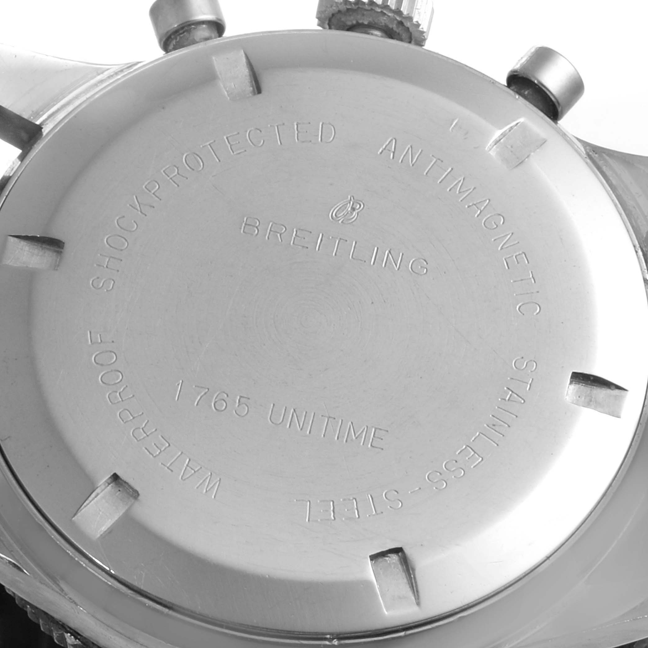 The image shows the case back of a Breitling Professional Series 1765 Men's Stainless Steel Black Dial 1765 Men's Stainless Steel Black Dial watch, featuring inscriptions and engravings.