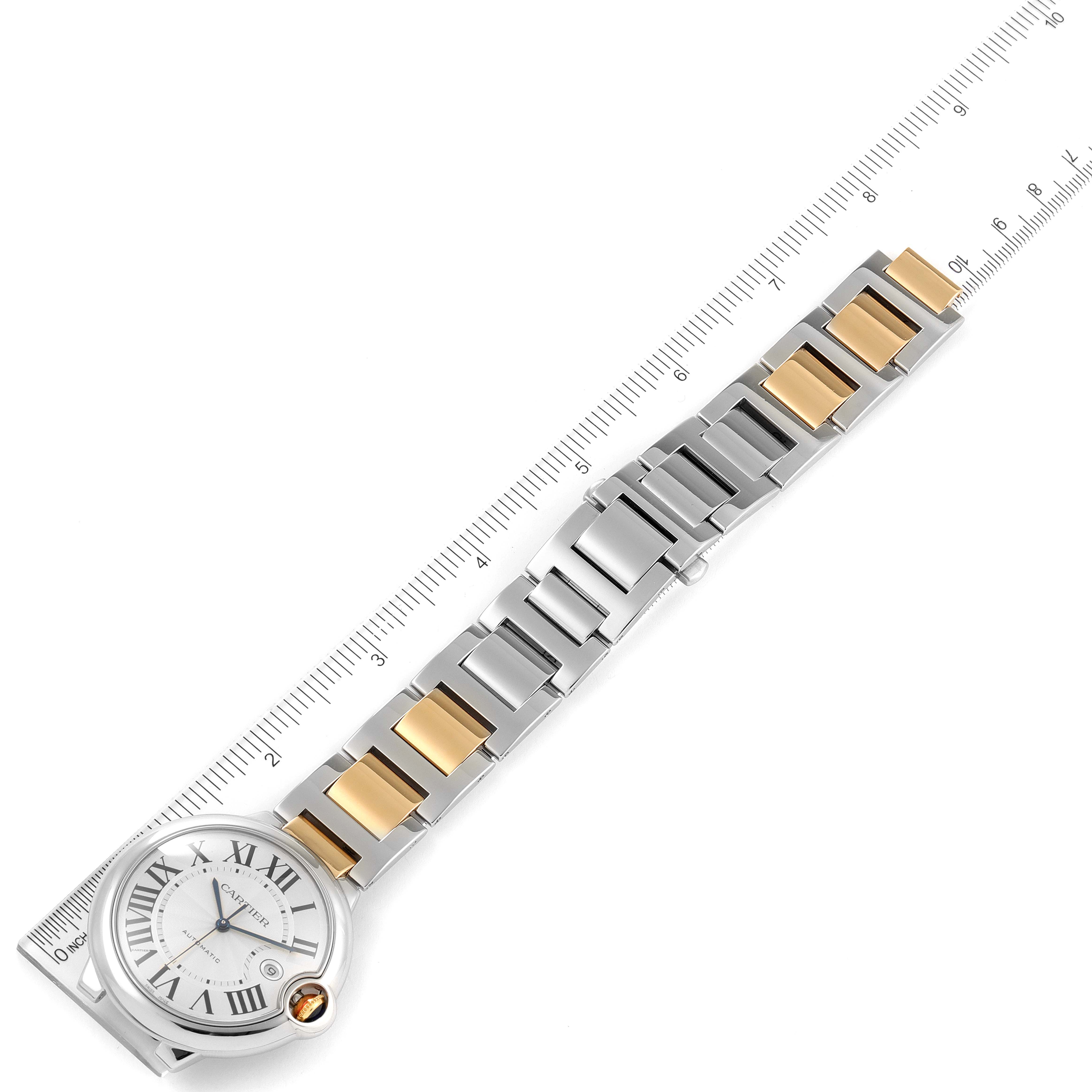 The image shows a top-down view of a Cartier Ballon Bleu W6900923 Men's Steel and Gold (two tone) Silver Dial W6900923 Men's Steel and Gold (two tone) Silver Dial watch, focusing on its face and metal link bracelet.