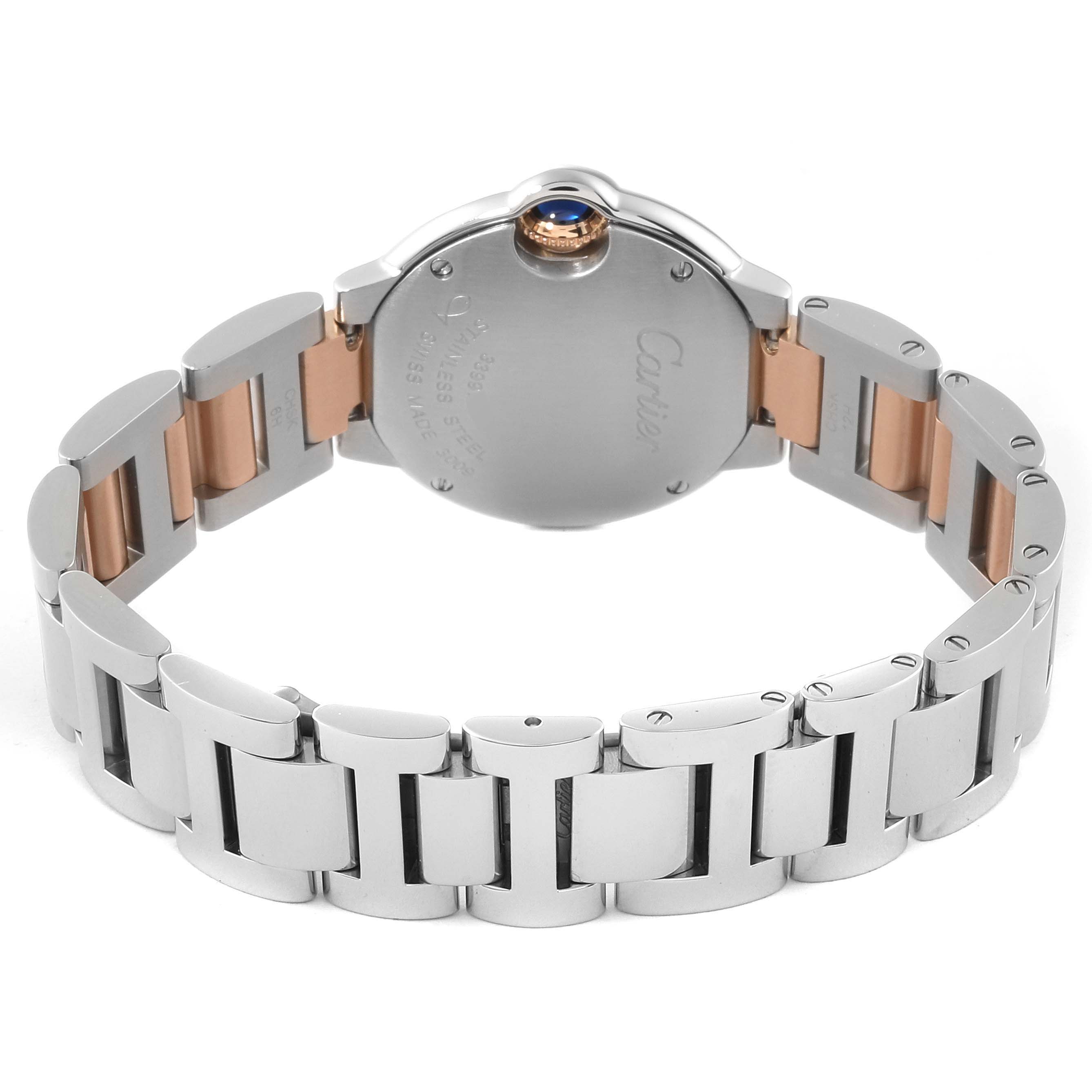 The image shows the back and bracelet of the Ballon Bleu de Cartier watch, highlighting the two-tone metal links.