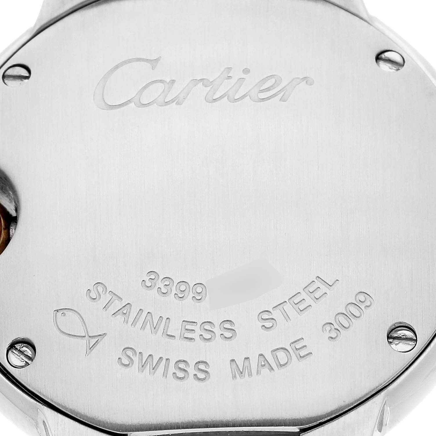 The image shows the back of a Ballon Bleu de Cartier watch, featuring engravings and screw details.