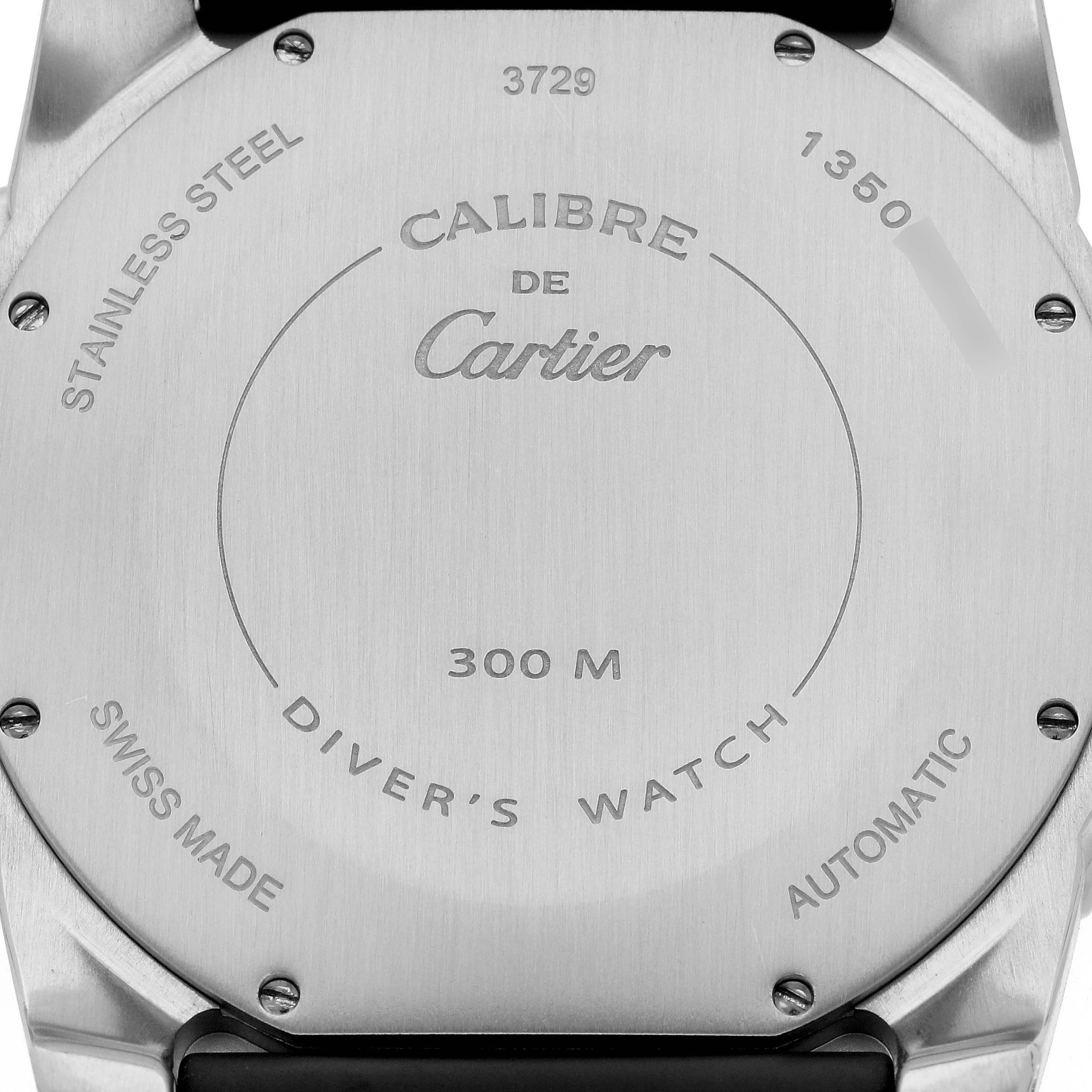This image shows the back side of a Calibre de Cartier diver
s watch by Cartier, revealing details like water resistance and material.