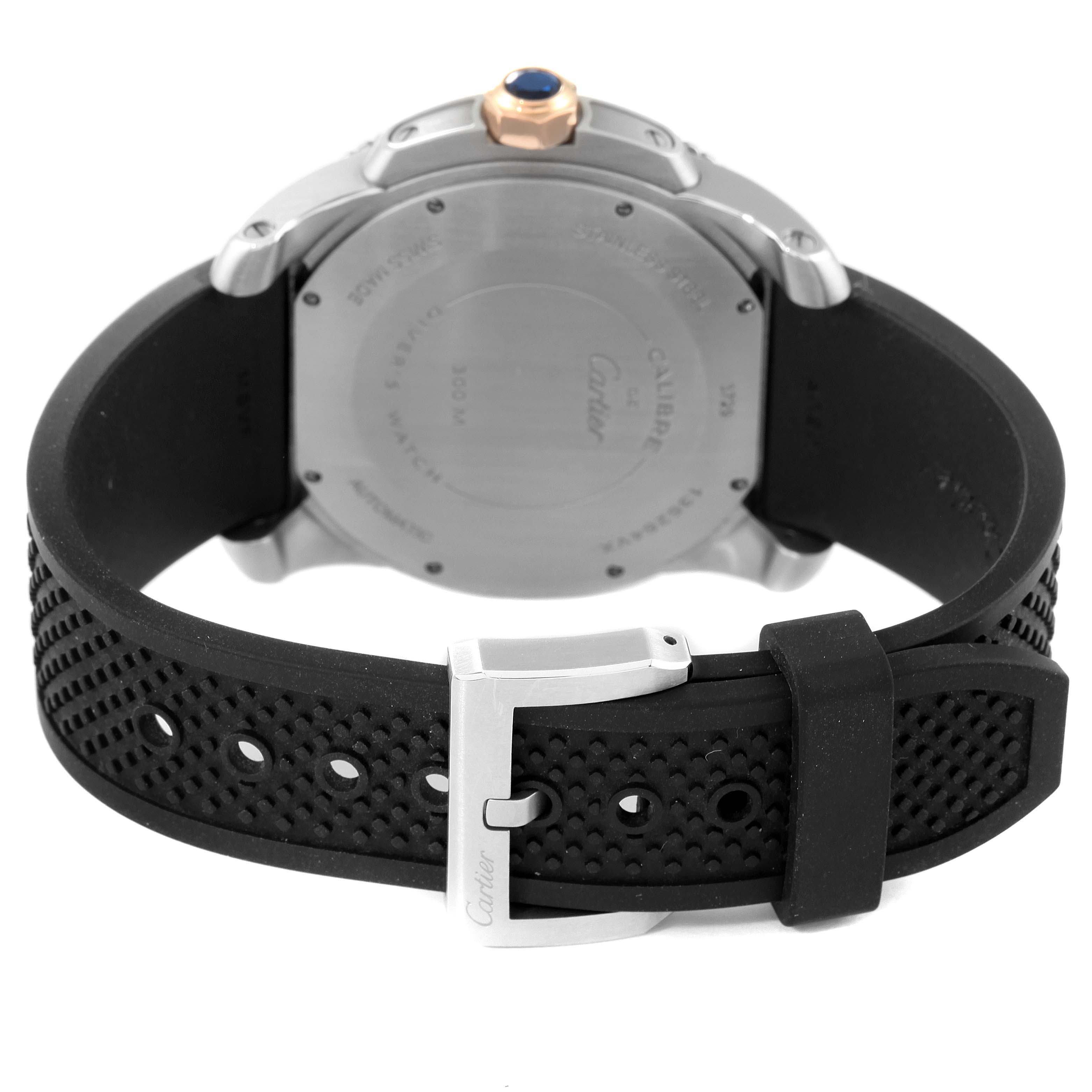 This image shows the back view of the Calibre de Cartier watch by Cartier, highlighting the case back and rubber strap with buckle.