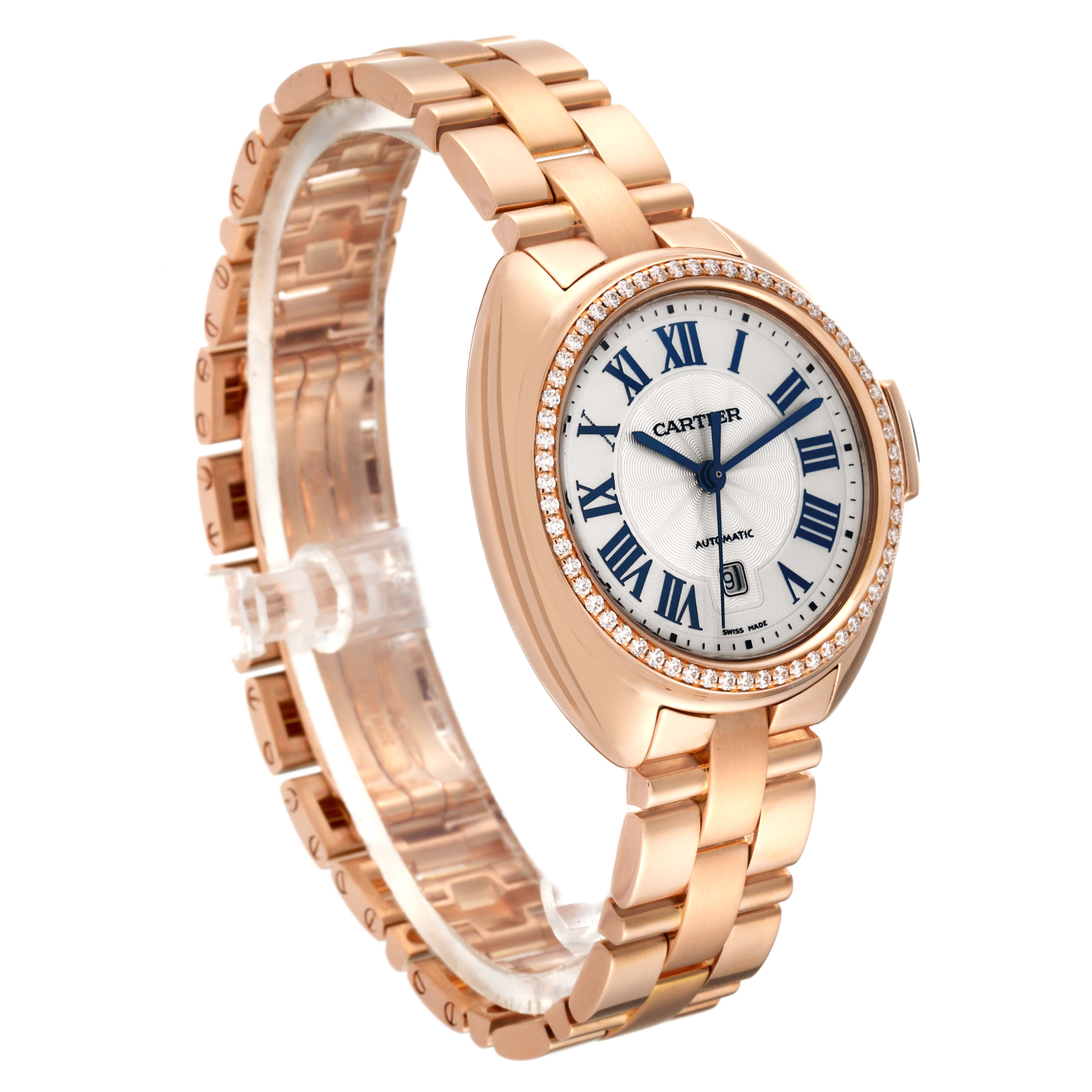 The watch in the image is a Cartier Clé model, shown at a three-quarter angle with its face, bracelet, and bezel visible.
