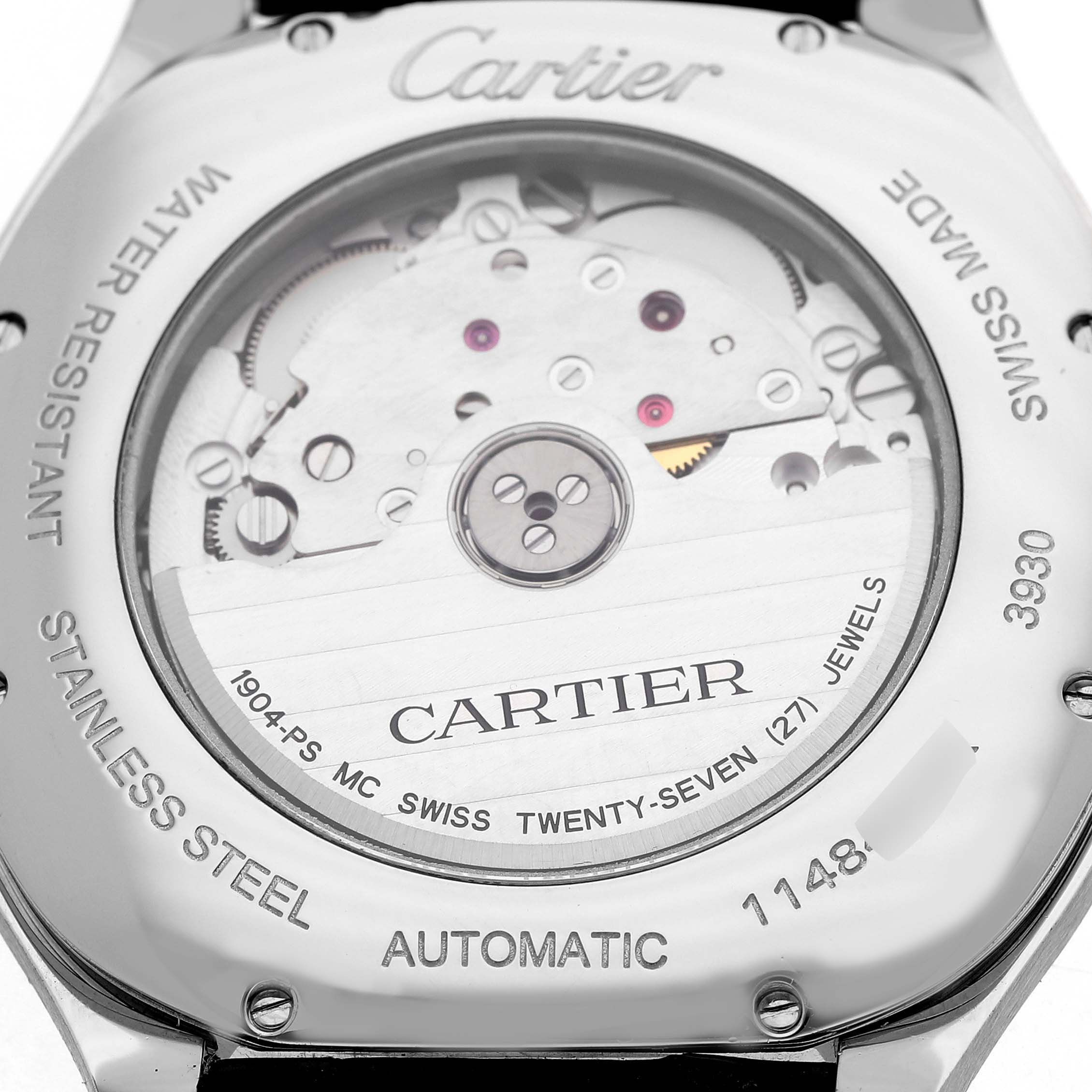 The image shows the back view of a Drive de Cartier watch, displaying the movement and engraving details.