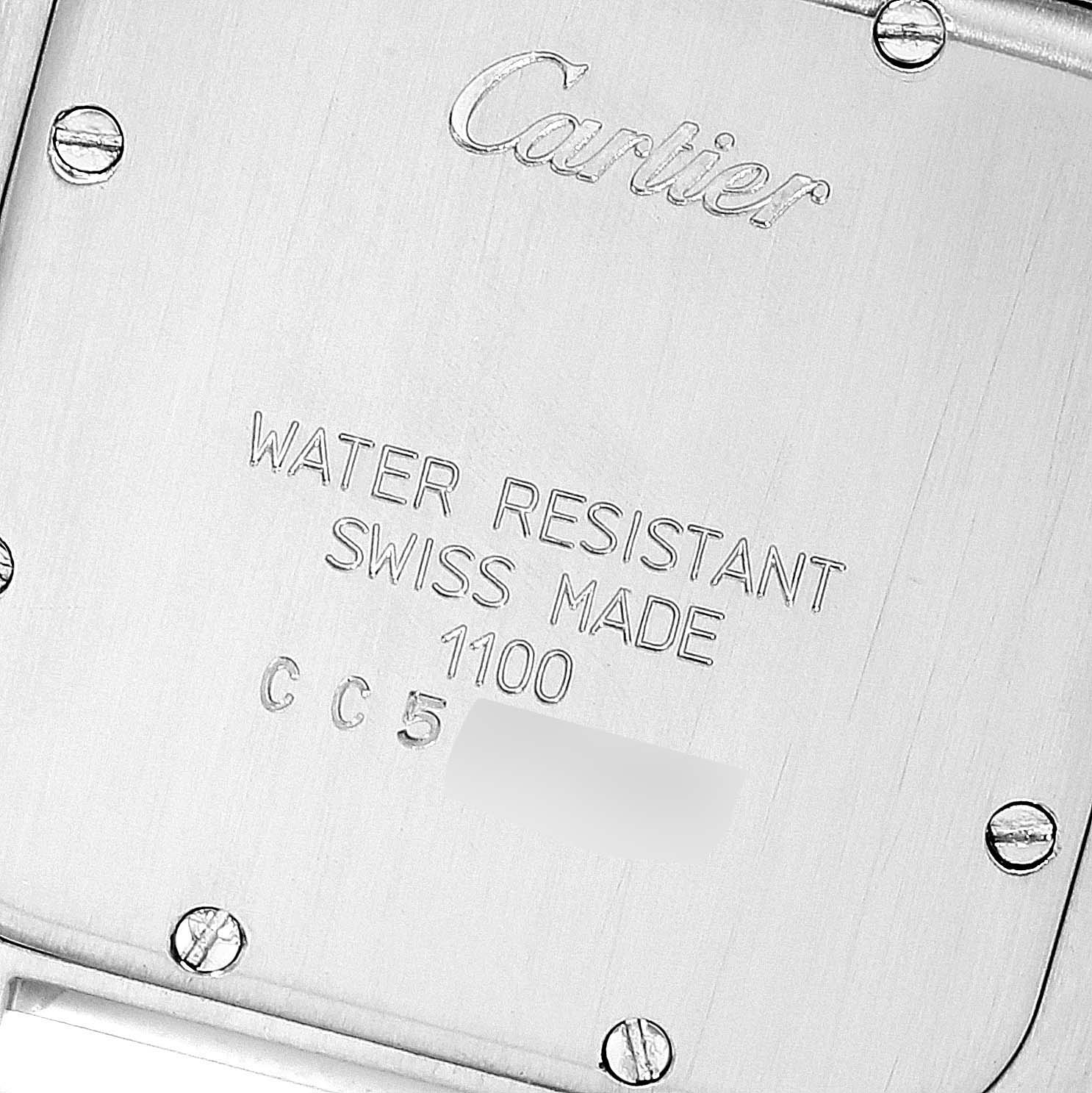 This image shows the back of the Cartier Panthere W25028B8 Men's Steel and Gold (two tone) Silver Dial W25028B8 Men's Steel and Gold (two tone) Silver Dial watch, focusing on the inscriptions and screws.