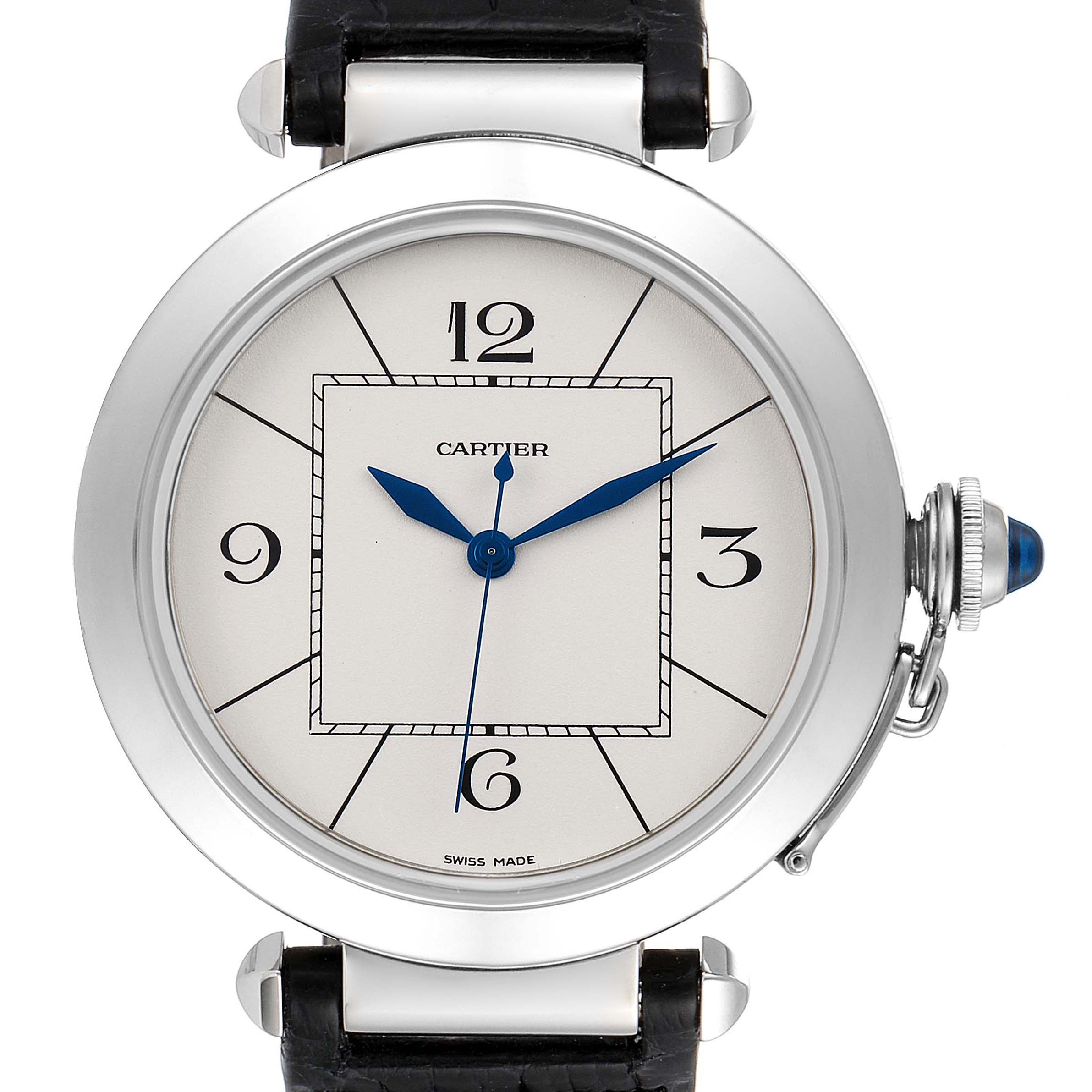 This image shows the front face of the Cartier Pasha W3107255 Men
s Stainless Steel Silver Dial W3107255 Men
s Stainless Steel Silver Dial watch, highlighting its dial, hands, numerals, and crown with a blue cabochon.