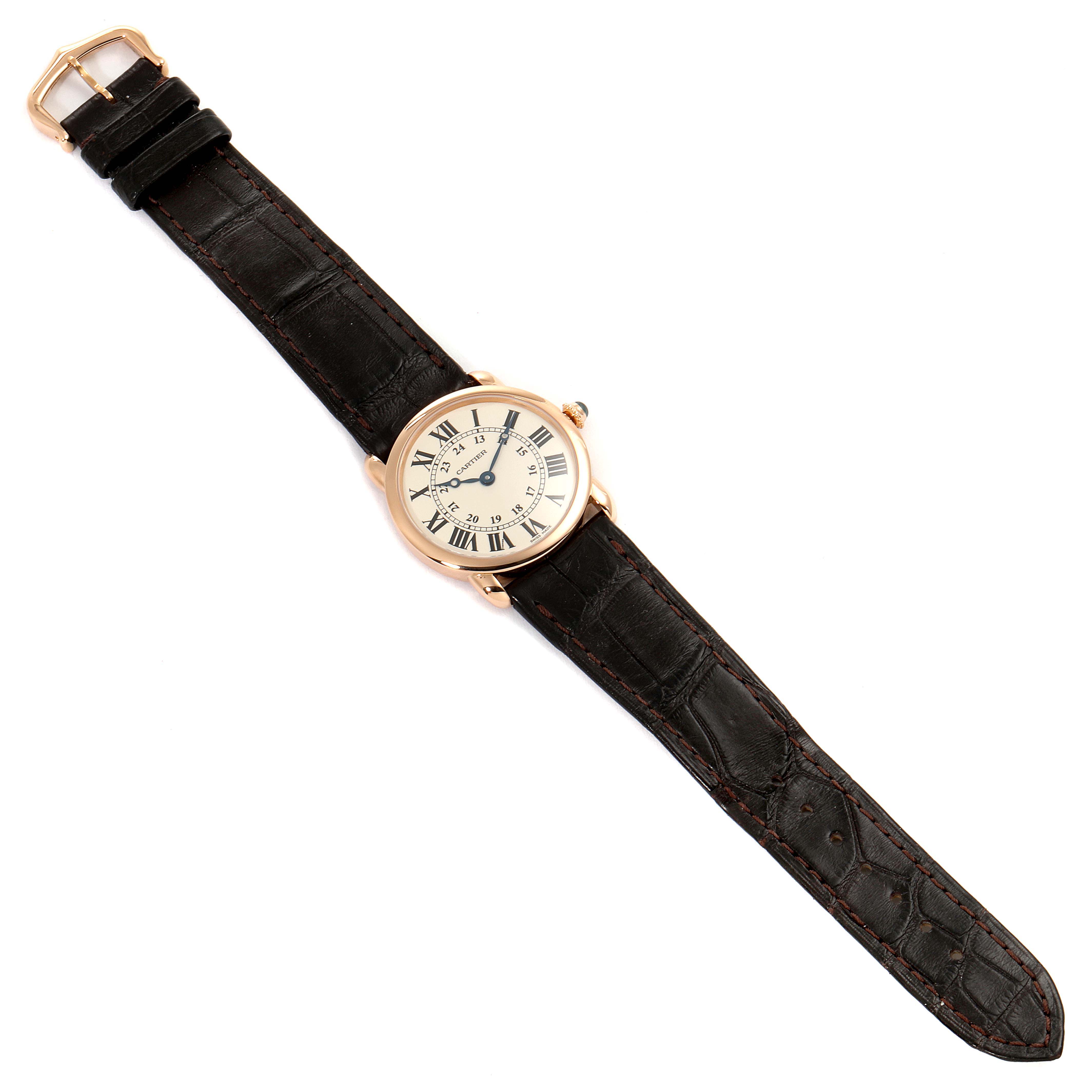 The Cartier Ronde W6800151 Women's Rose Gold Silver Dial W6800151 Women's Rose Gold Silver Dial watch is shown from a top-down angle displaying its face and full leather strap.