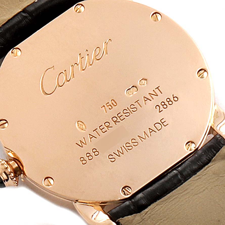 This image shows the back case of a Cartier Ronde W6800151 Women's Rose Gold Silver Dial W6800151 Women's Rose Gold Silver Dial watch at a close-up angle, revealing inscriptions and four screws.