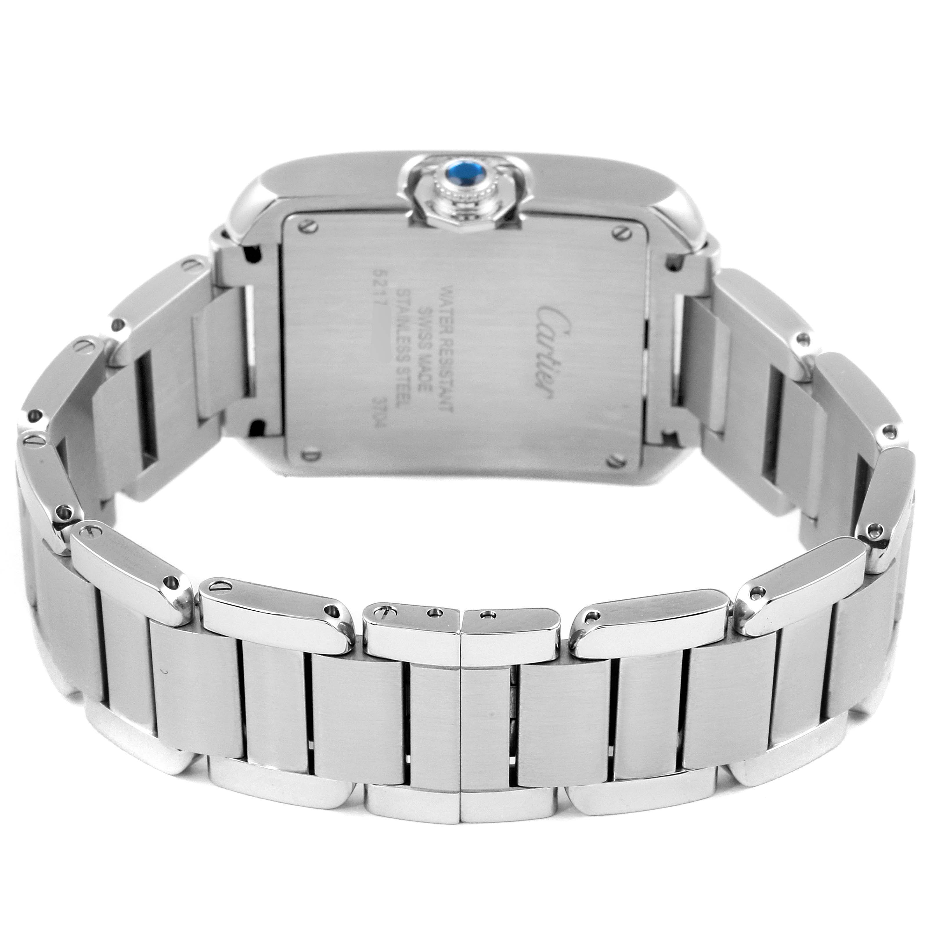 The image shows the back and bracelet of a Cartier Tank Anglaise W5310022 Women's Stainless Steel Silver Dial W5310022 Women's Stainless Steel Silver Dial watch, highlighting the stainless steel case and the crown with a blue gemstone.