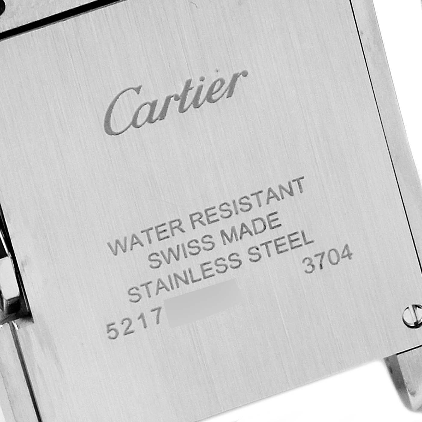 This image shows the engraved back case of a Cartier Tank Anglaise W5310022 Women's Stainless Steel Silver Dial W5310022 Women's Stainless Steel Silver Dial watch, highlighting its water resistance and stainless steel material.