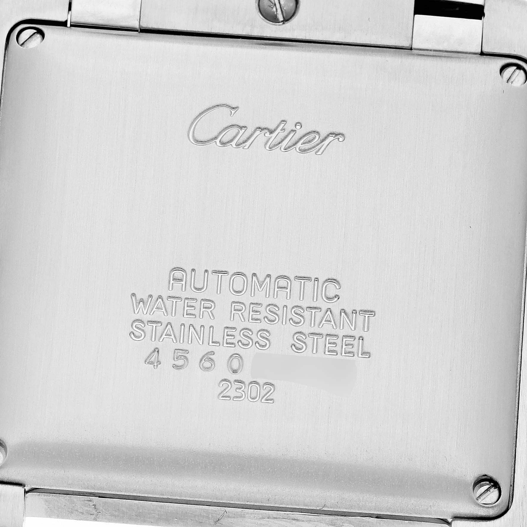 The image shows the back case of a Cartier Tank Française watch, displaying details about its automatic movement, water resistance, and stainless steel material.