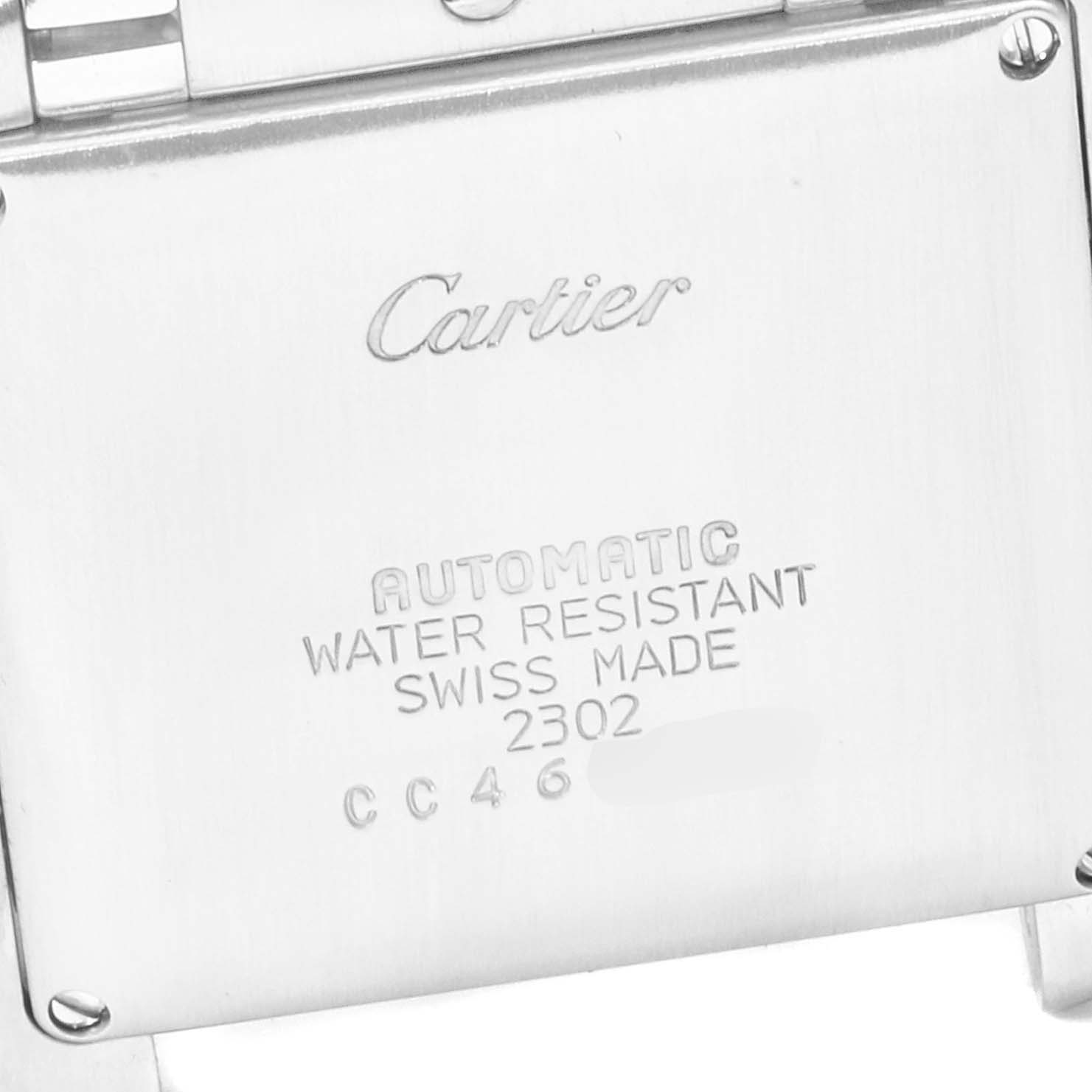 The image shows the back case of a Cartier Tank Française watch displaying engraved branding and technical details.
