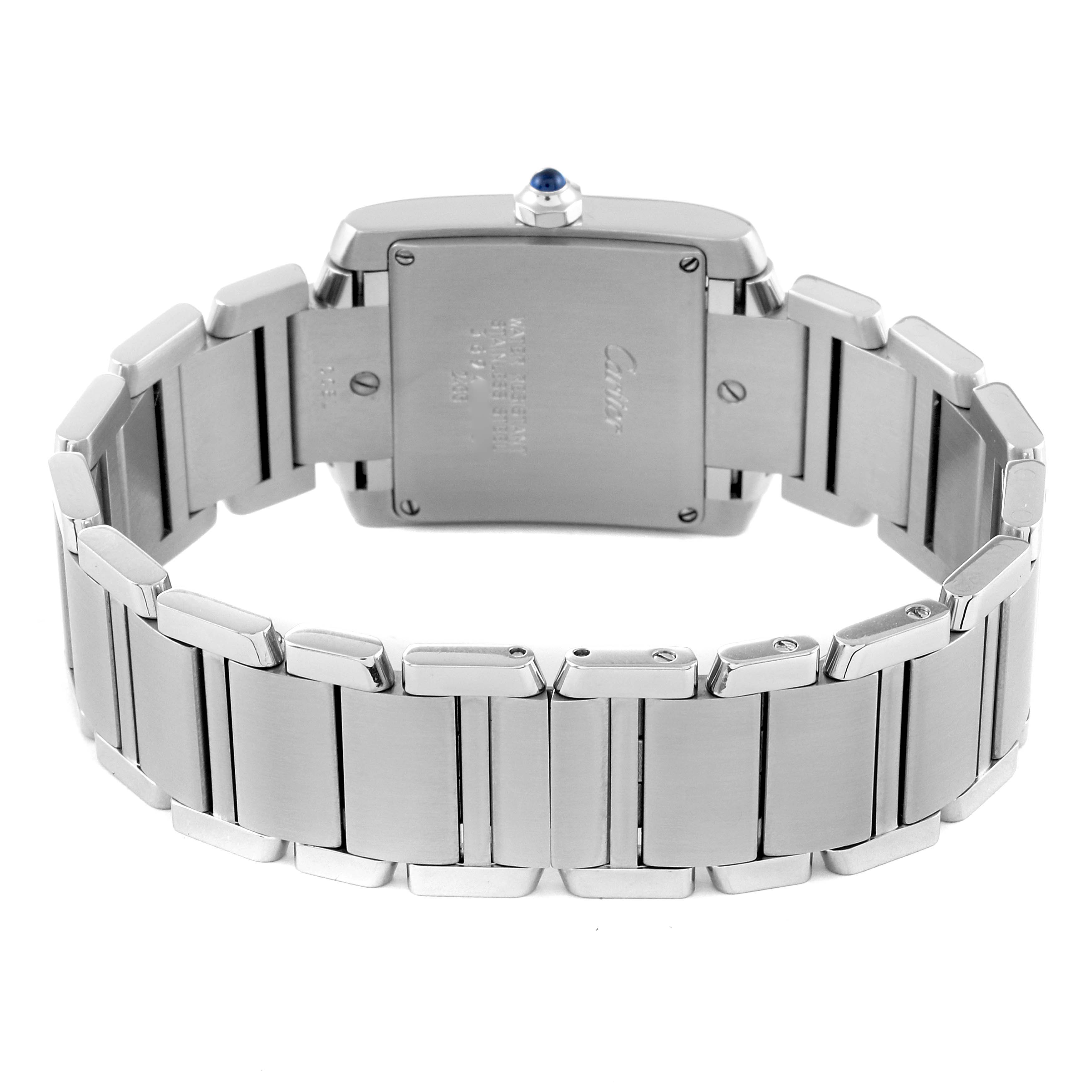 The image shows the back view of a Tank Francaise model by Cartier, displaying the case back and metal bracelet.