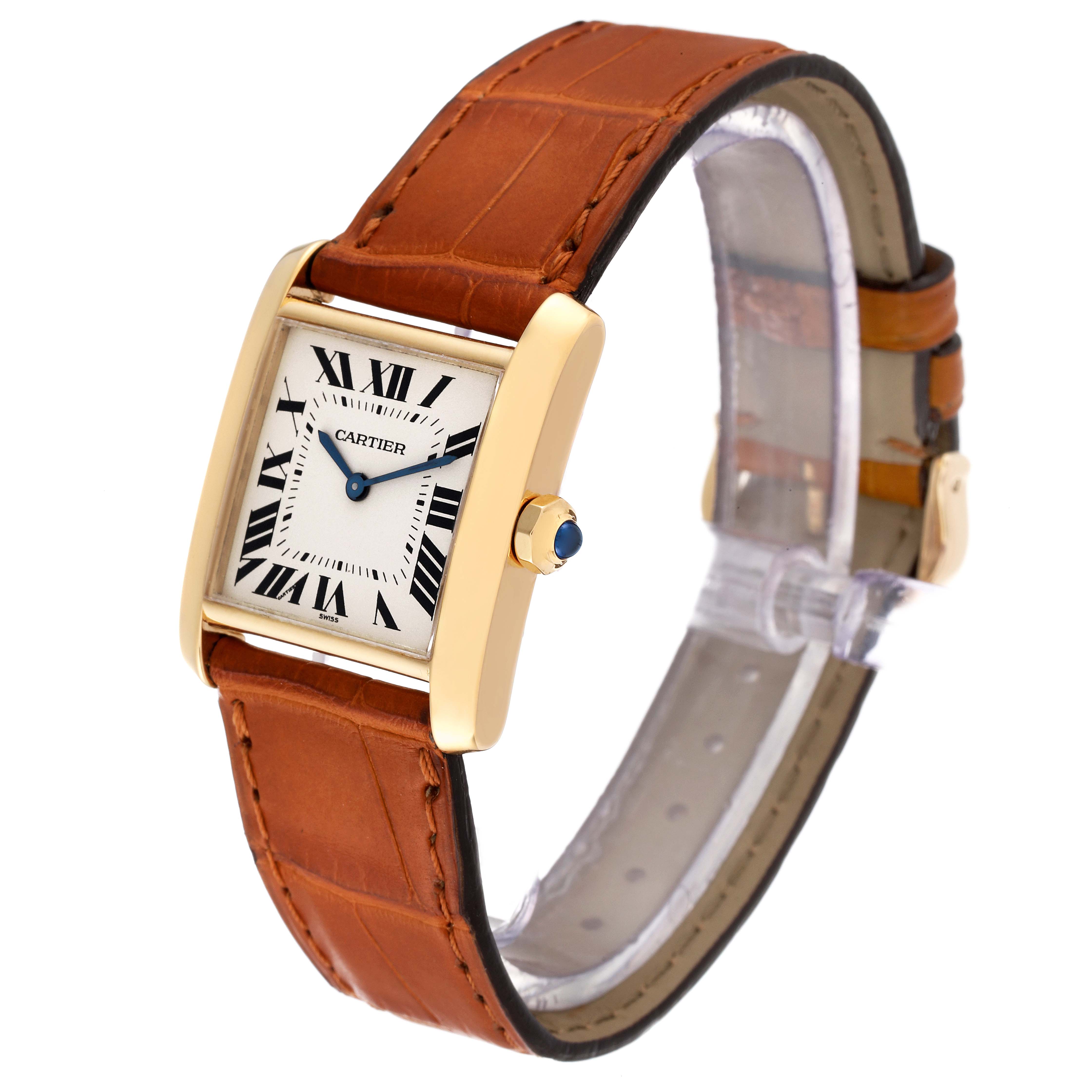 The image shows a Cartier Tank Française watch at an angle displaying the face, strap, and crown with a blue gem.
