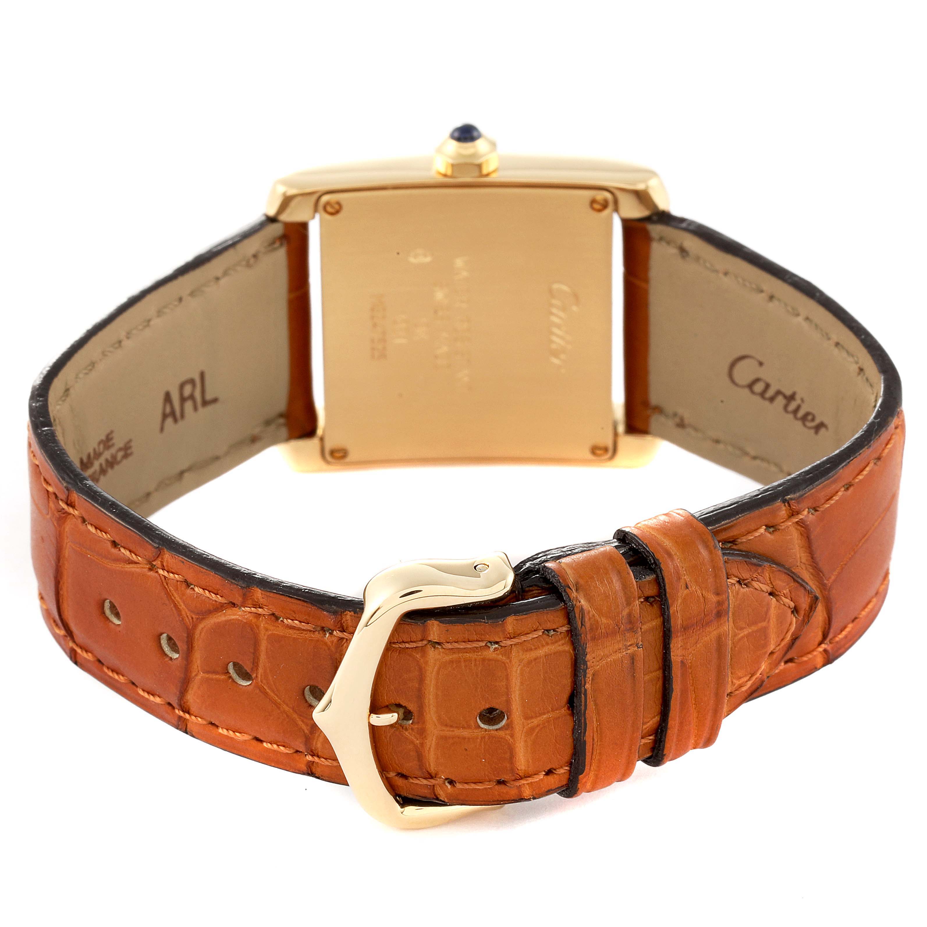 The image shows the back view of a Cartier Tank Francaise W5000356 Women's Yellow Gold Silver Dial W5000356 Women's Yellow Gold Silver Dial watch with its gold case and brown leather strap, including the buckle.