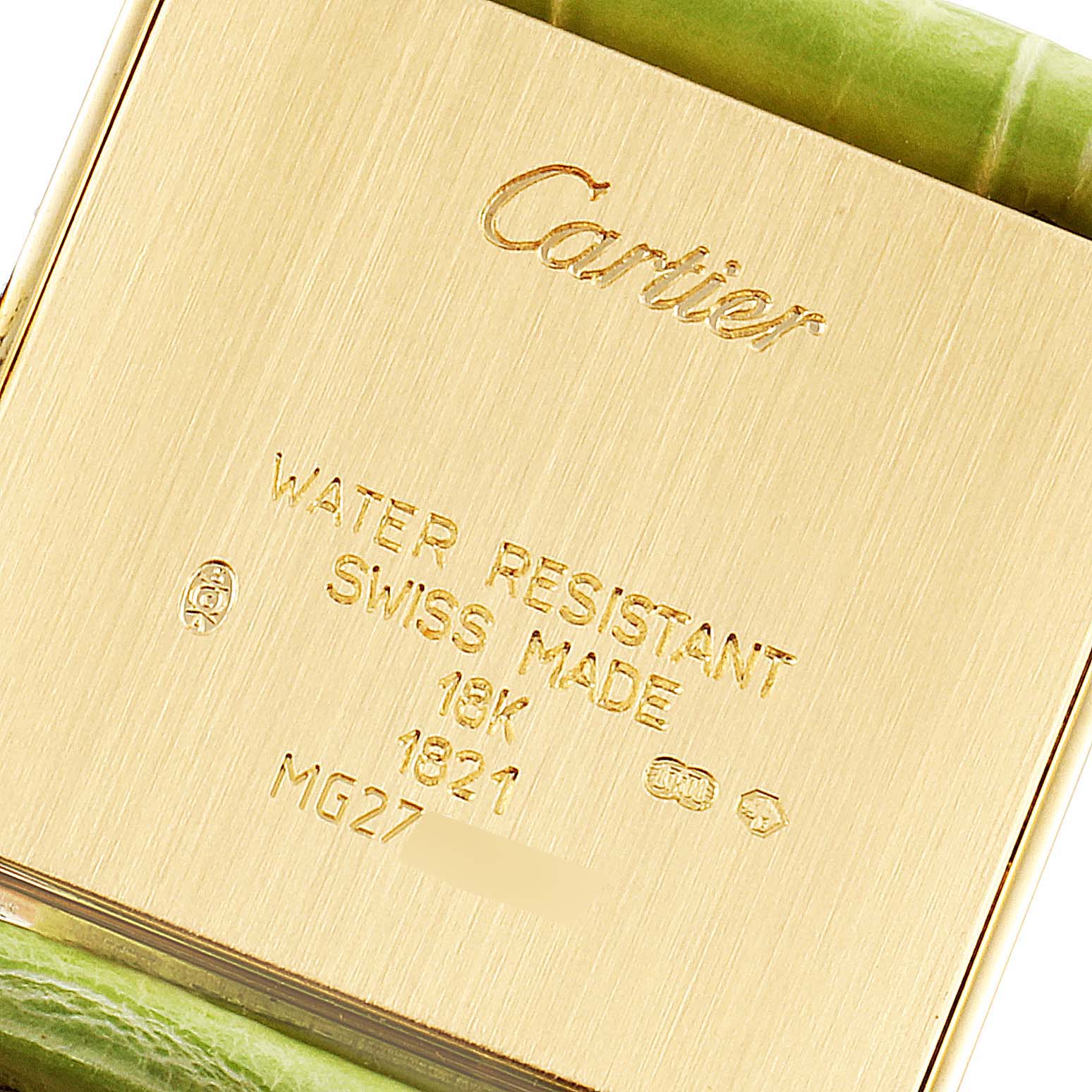 This image shows the back case of a Cartier Tank Française watch, highlighting its inscriptions and green strap.