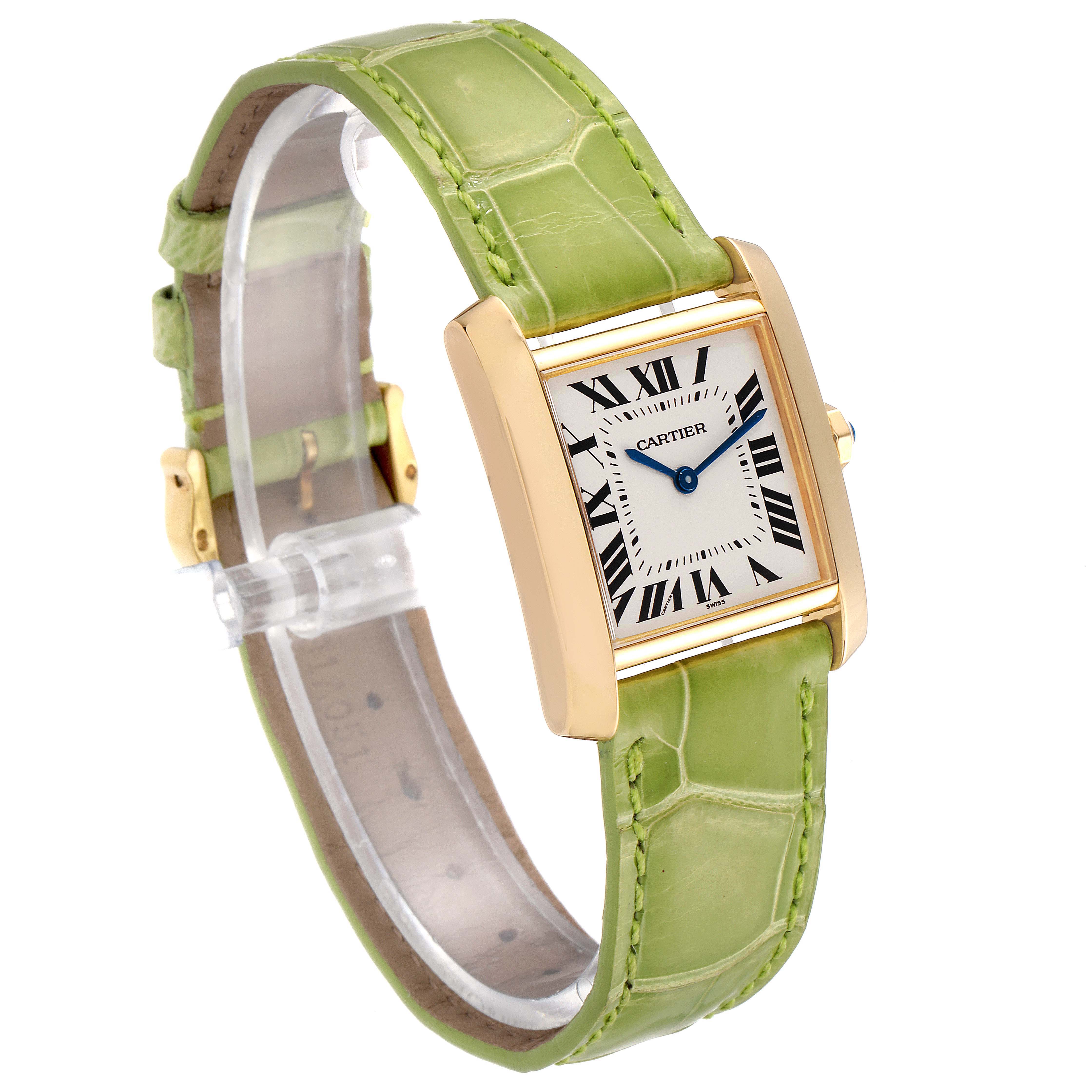 This image shows a Cartier Tank Francaise W5000356 Women's Yellow Gold Silver Dial W5000356 Women's Yellow Gold Silver Dial watch at a three-quarter angle, highlighting its green strap and square face with Roman numerals.