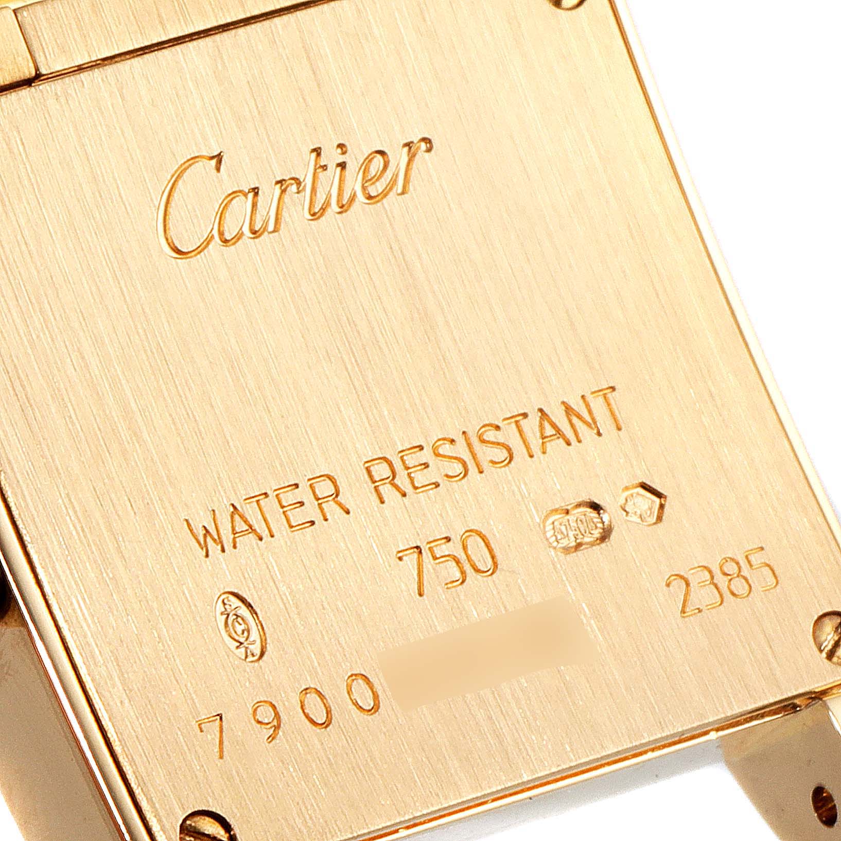 This image shows the engraved back case of a Cartier Tank Francaise W50002N2 Women's Yellow Gold Silver Dial W50002N2 Women's Yellow Gold Silver Dial watch at a close-up angle.