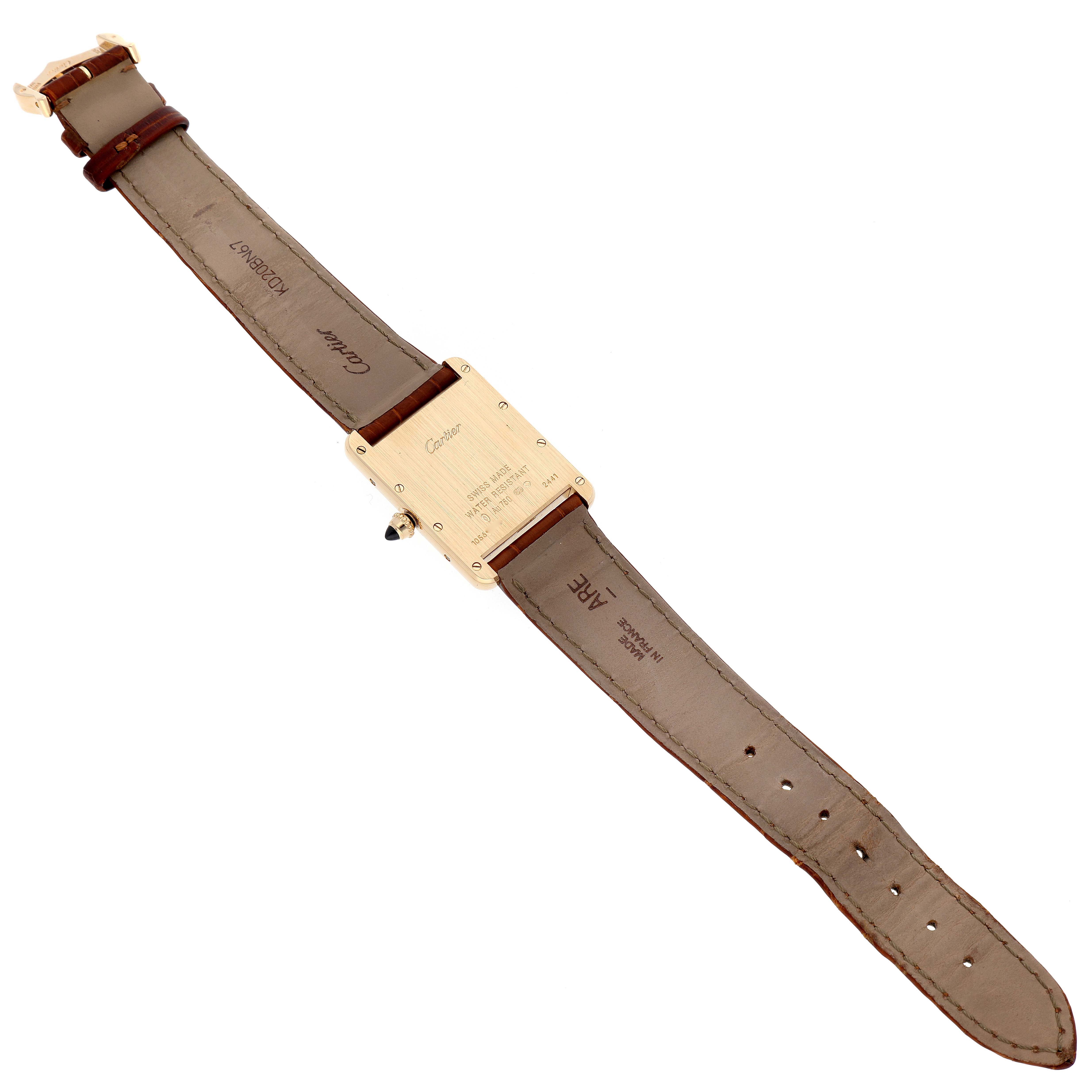 The image shows the back view of a Tank Louis model by Cartier, including the entire strap and case back with engravings.