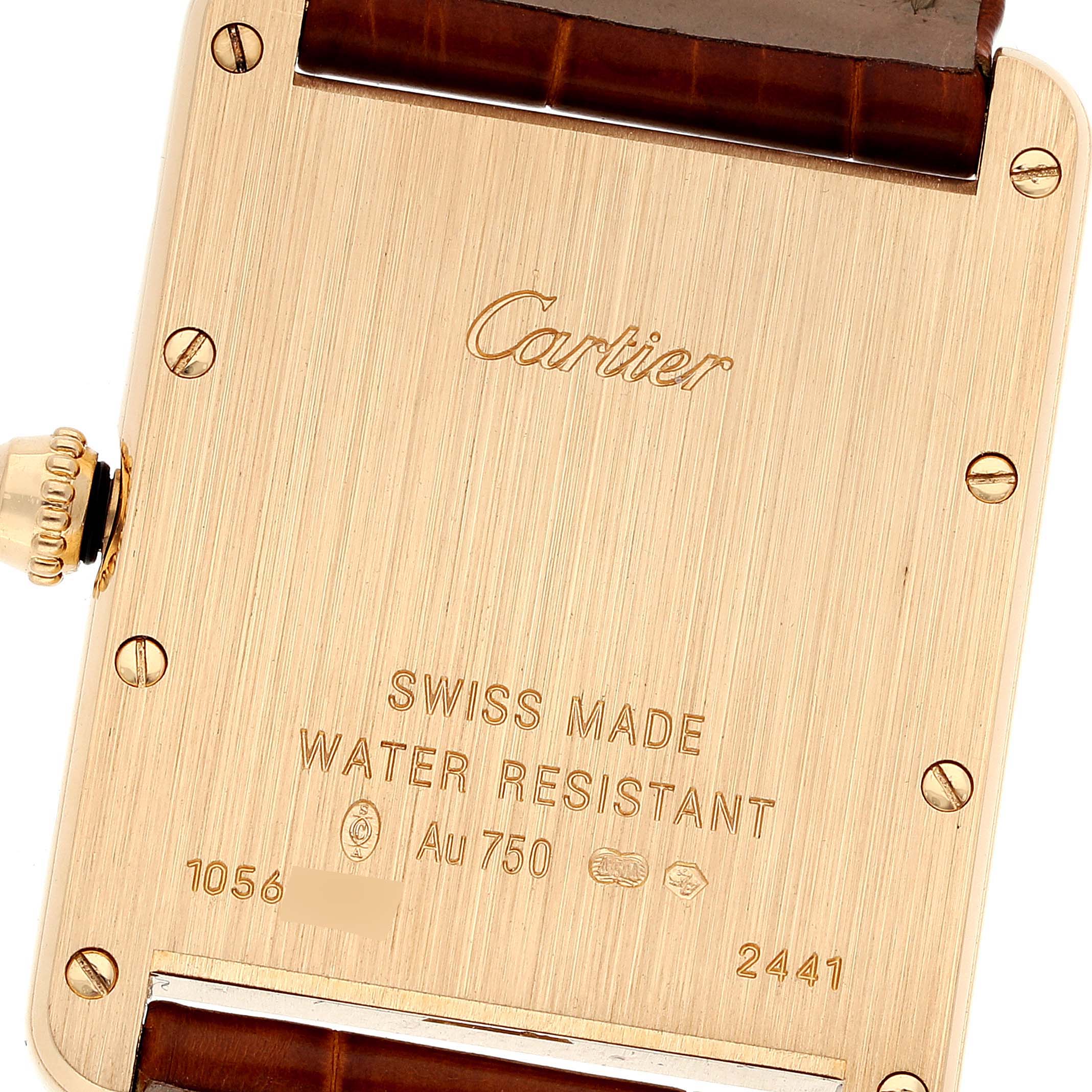 The image shows the back case of a Cartier Tank Louis W1529756 Men
s Yellow Gold Silver Dial W1529756 Men
s Yellow Gold Silver Dial watch, including the brand name, serial number, and specifications.