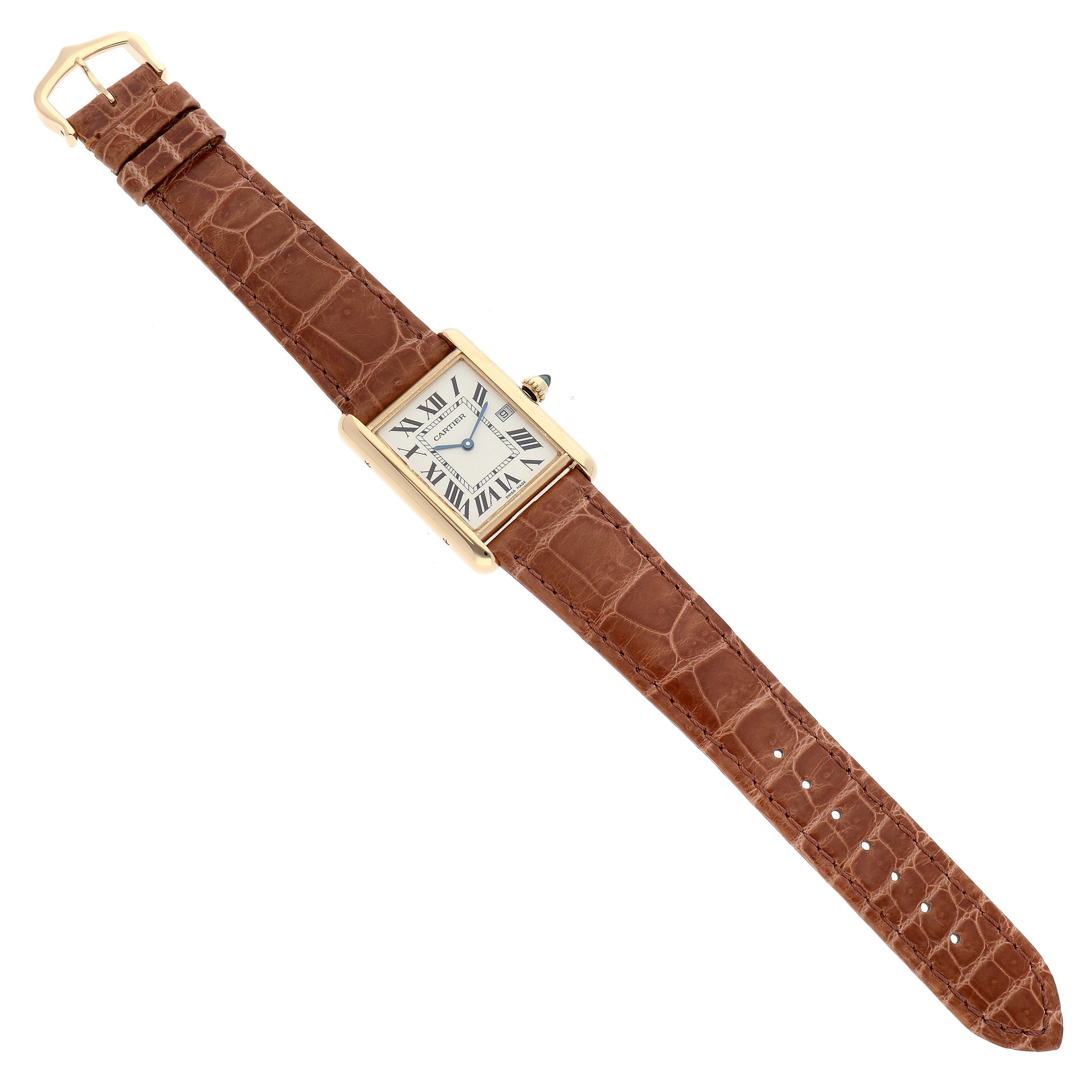 The Cartier Tank Louis W1529756 Men's Yellow Gold Silver Dial W1529756 Men's Yellow Gold Silver Dial watch is shown from a top-down angle, displaying its face, bezel, crown, and entire leather strap.