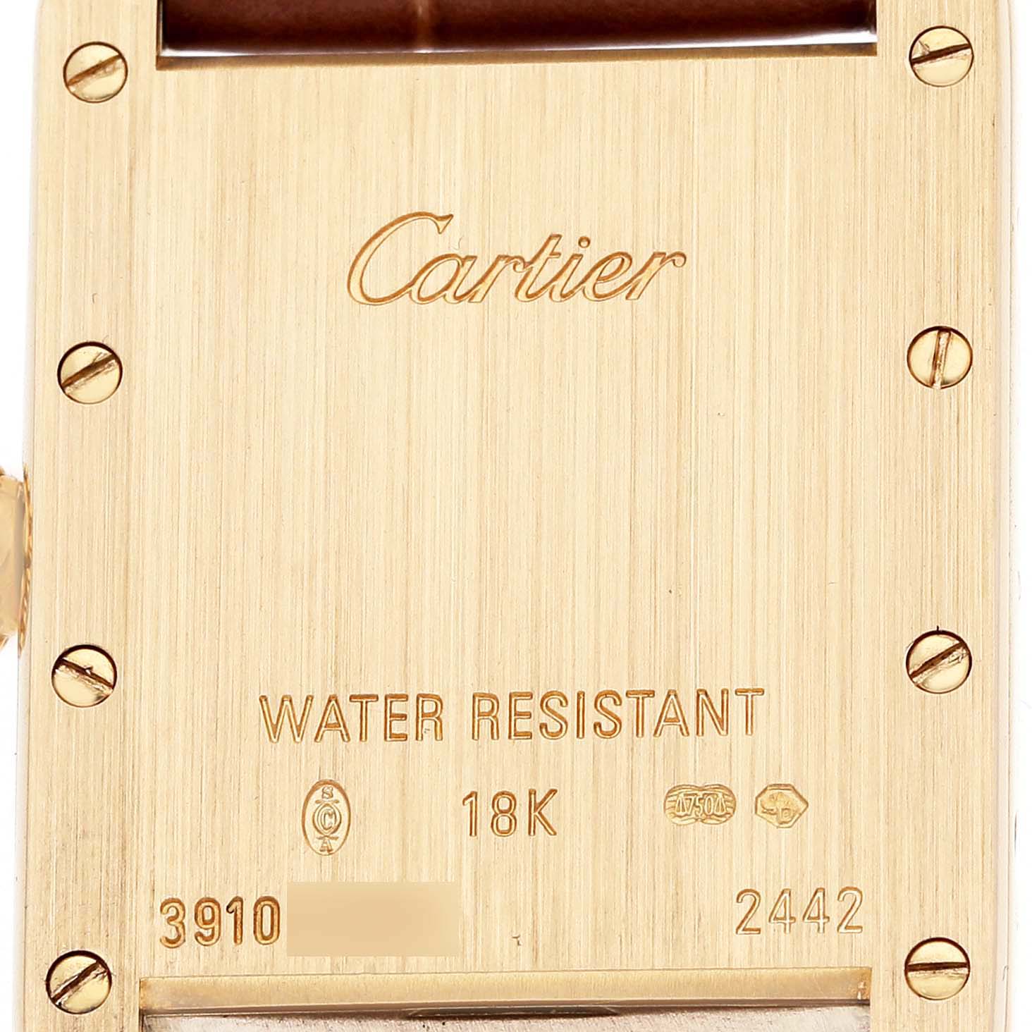 The image shows the back of the Cartier Tank Louis W1529856 Women's Yellow Gold Silver Dial watch, highlighting engravings and screw details.